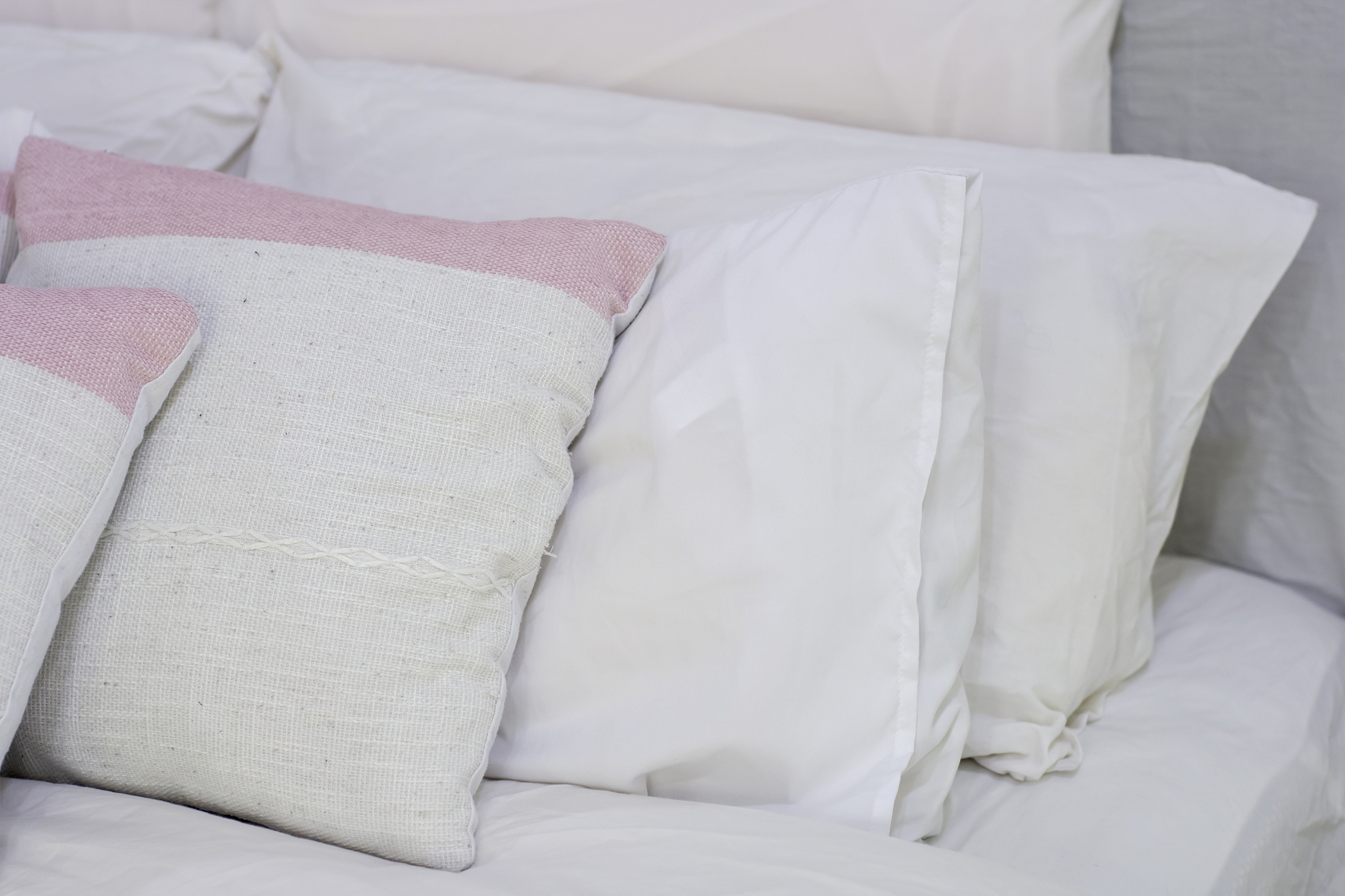 decorative pillow natural fabric on the bed