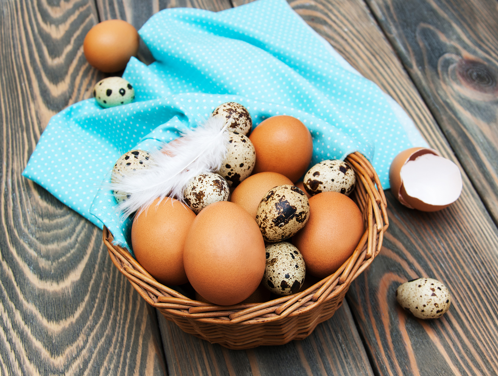 different types of eggs in a basket