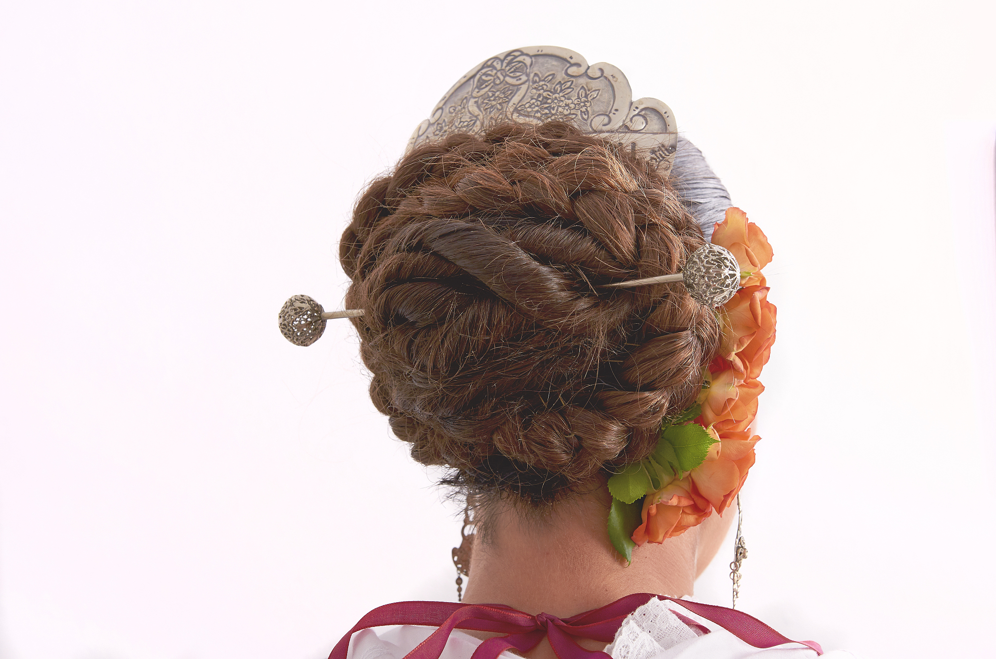 beautiful woman is wearing a flowers in her hairs. regional cust