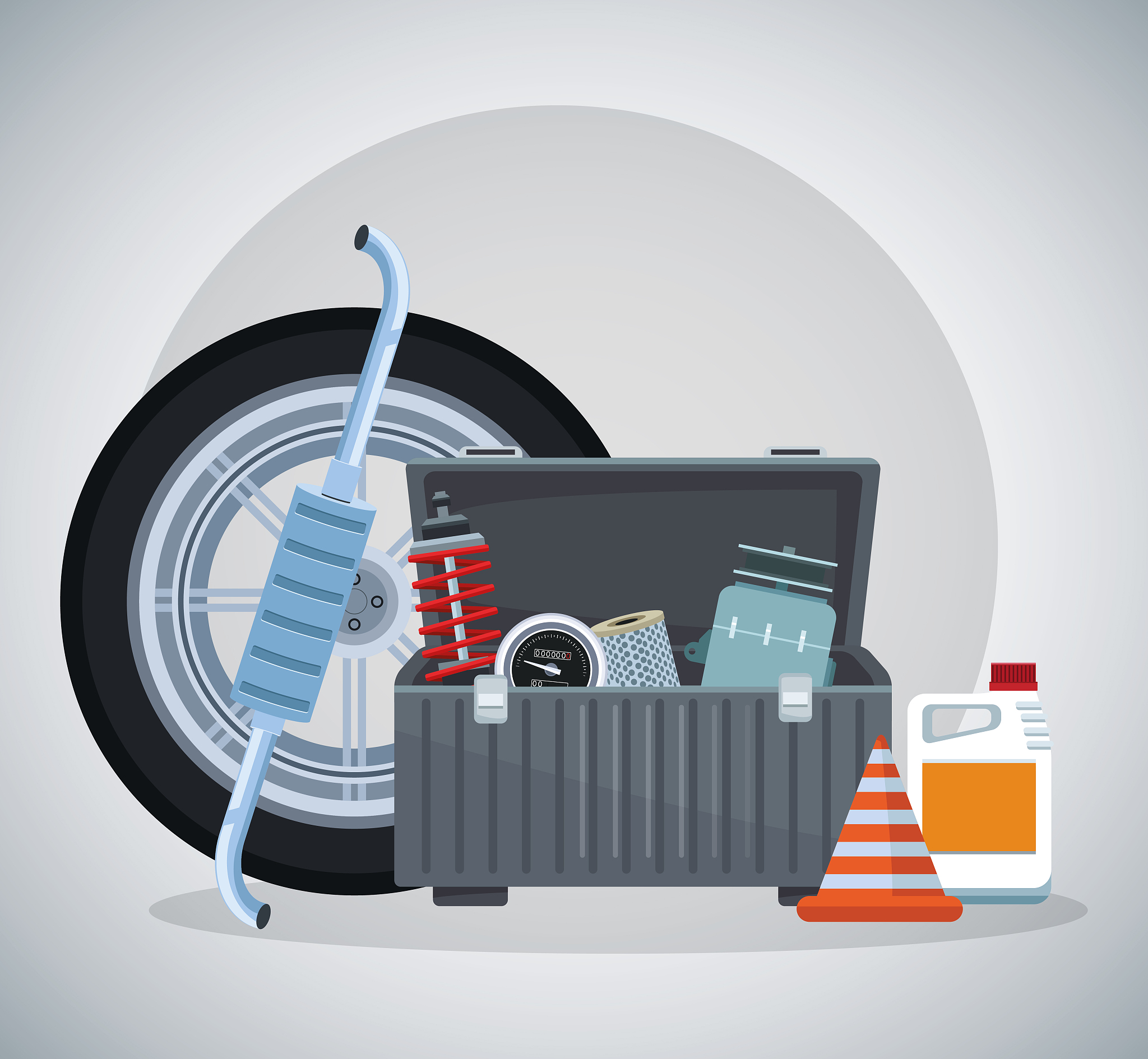 car tire with tools box, oil bottle and traffic cone