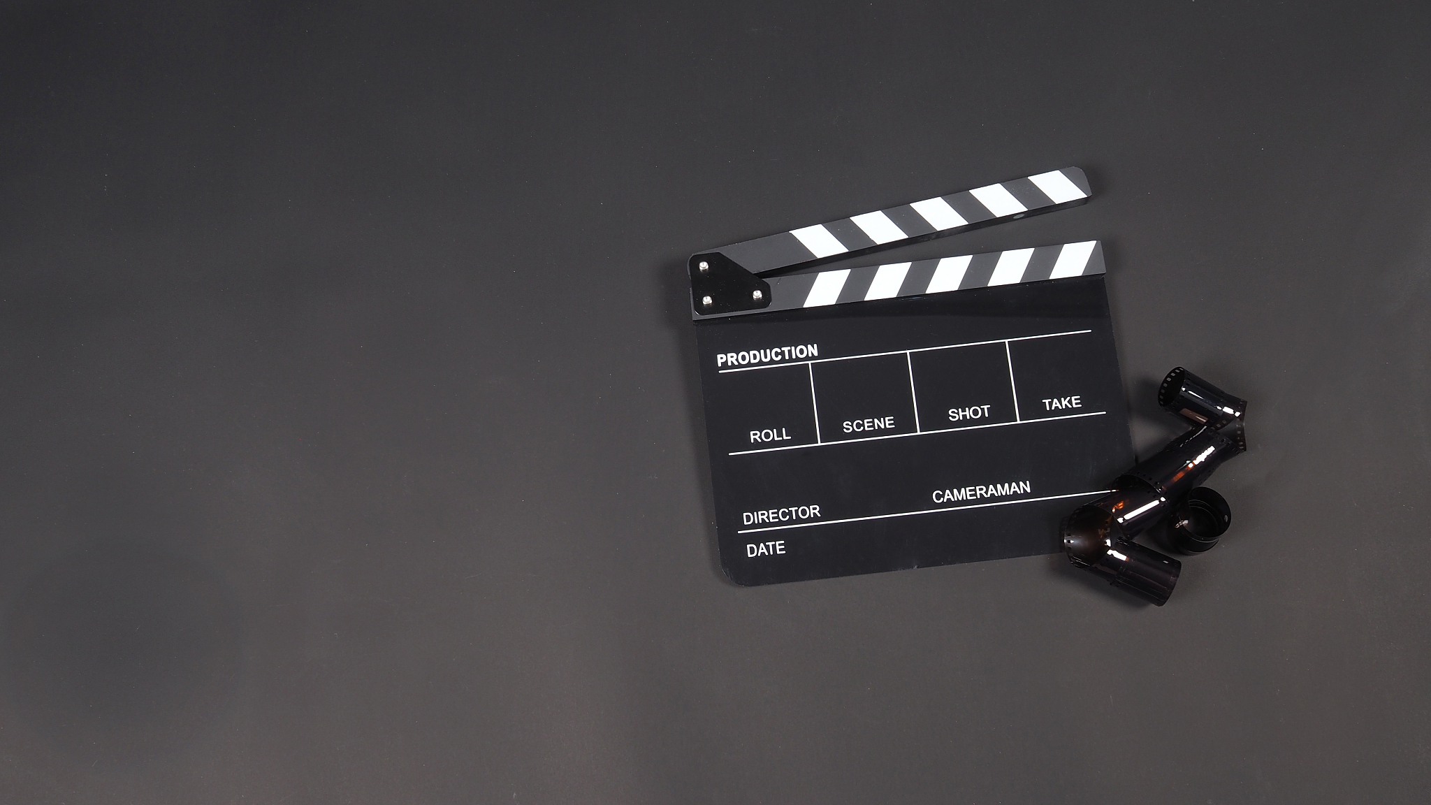 high angle view of film slate and camera film on table