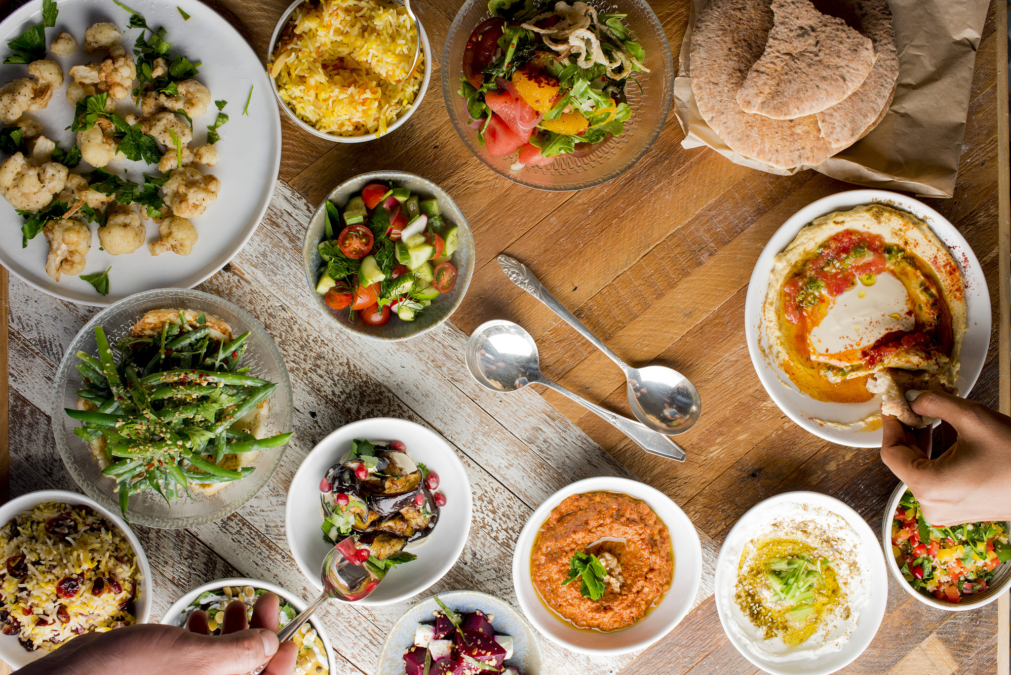 spreads and dips served at a greek or turkish table setting. an 