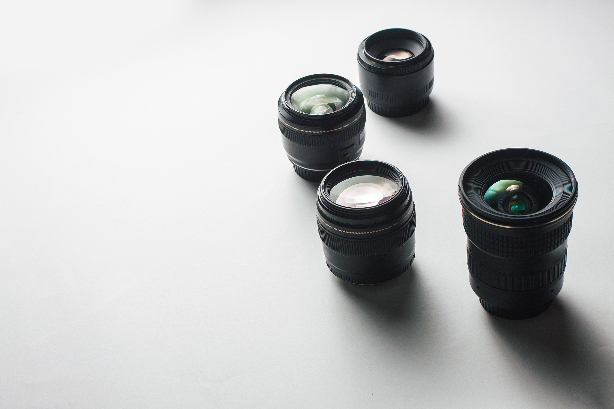 high angle view of camera lenses over white background