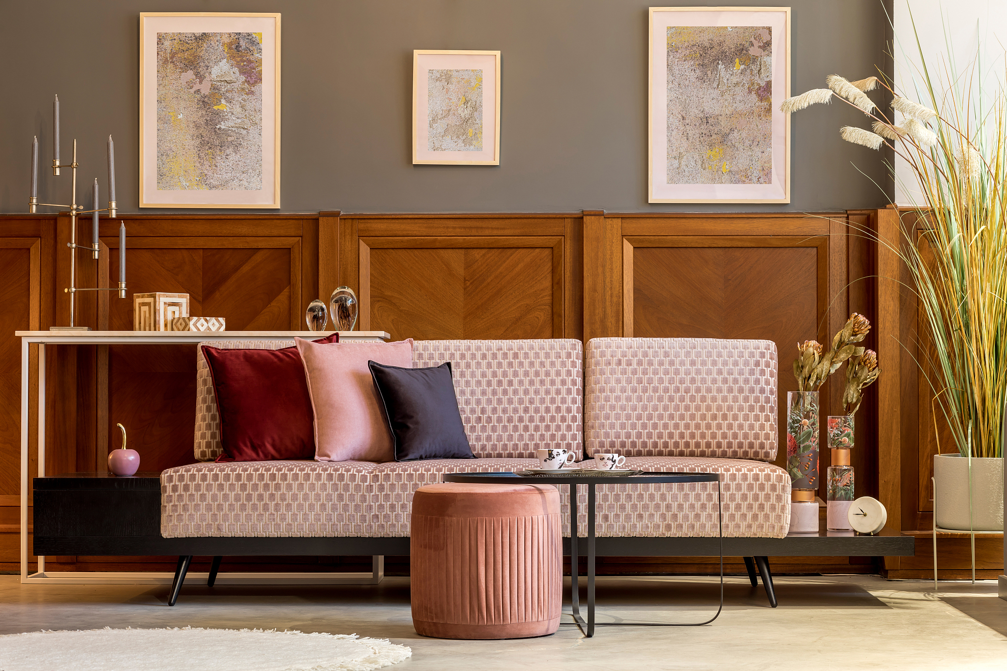 stylish interior of living room with design pink sofa, elegant p