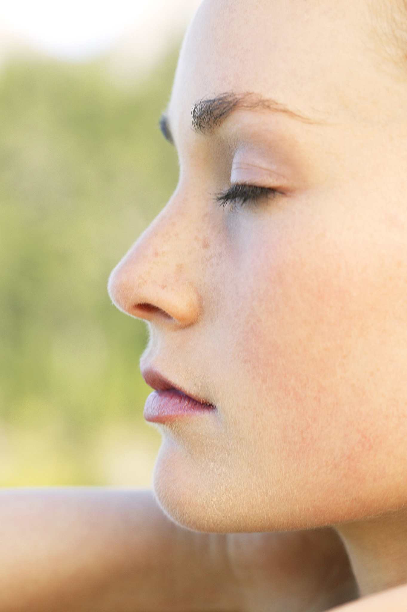 profile of womans face with eyes closed