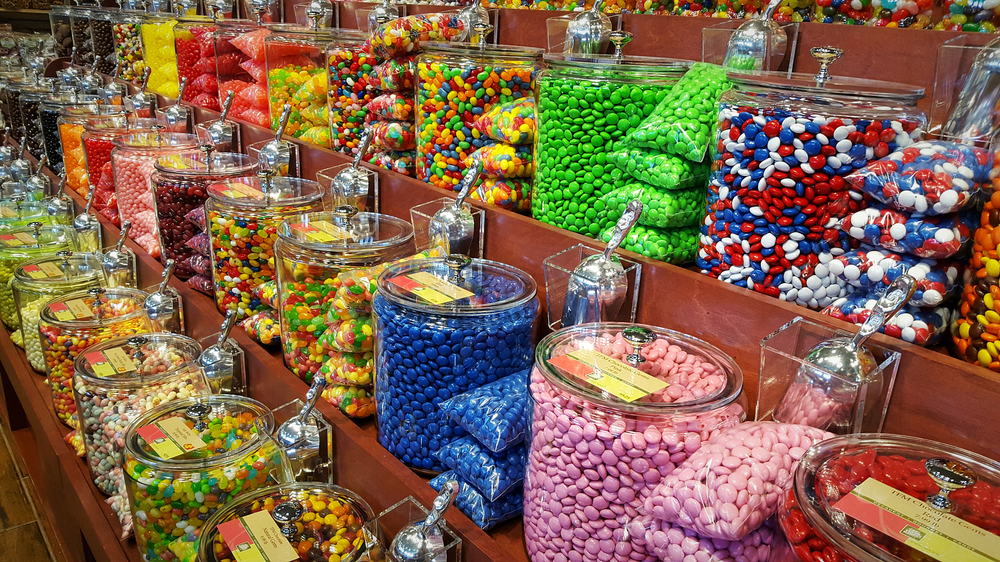 colorful candies in racks for sale at store