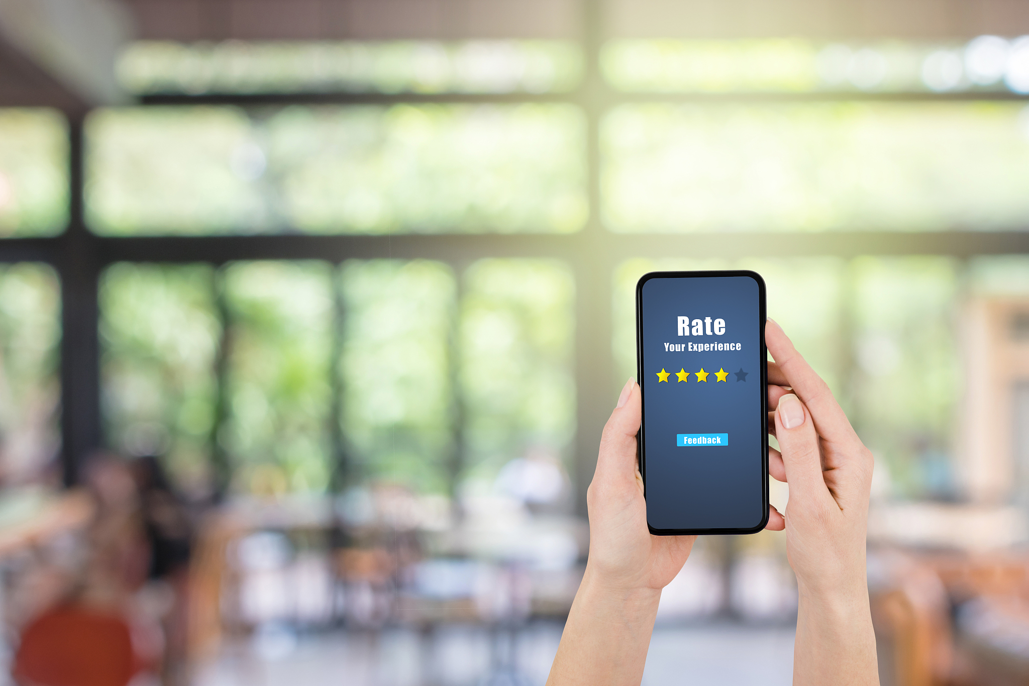 hand holding smartphone and giving best service ranking with blu