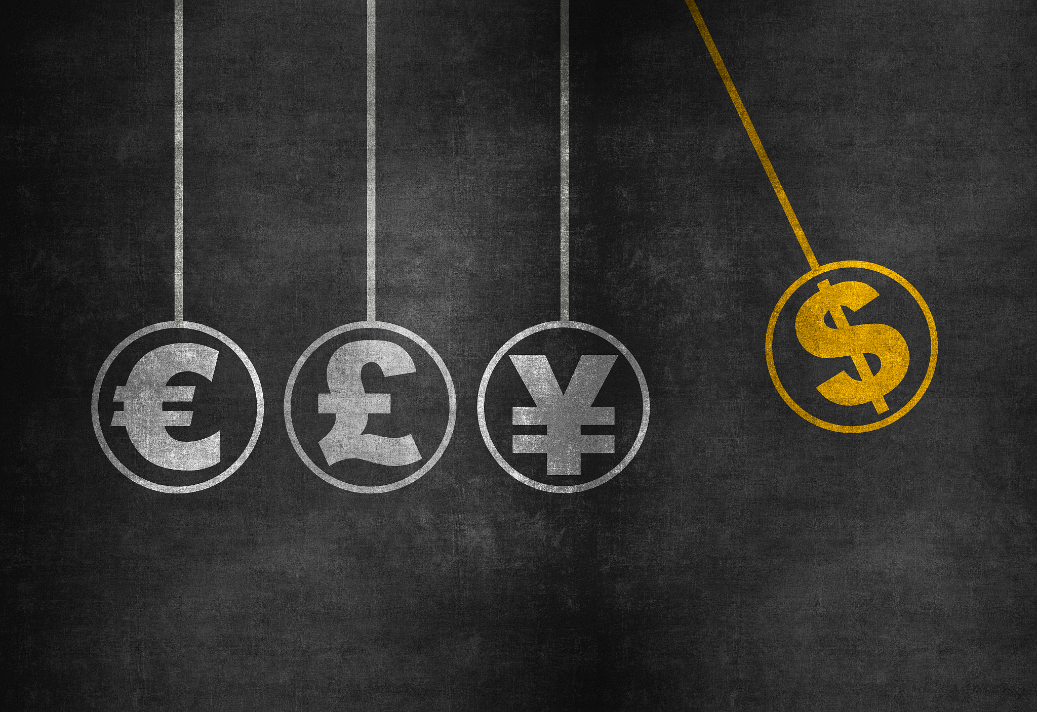 pendulum with currency symbols on blackboard