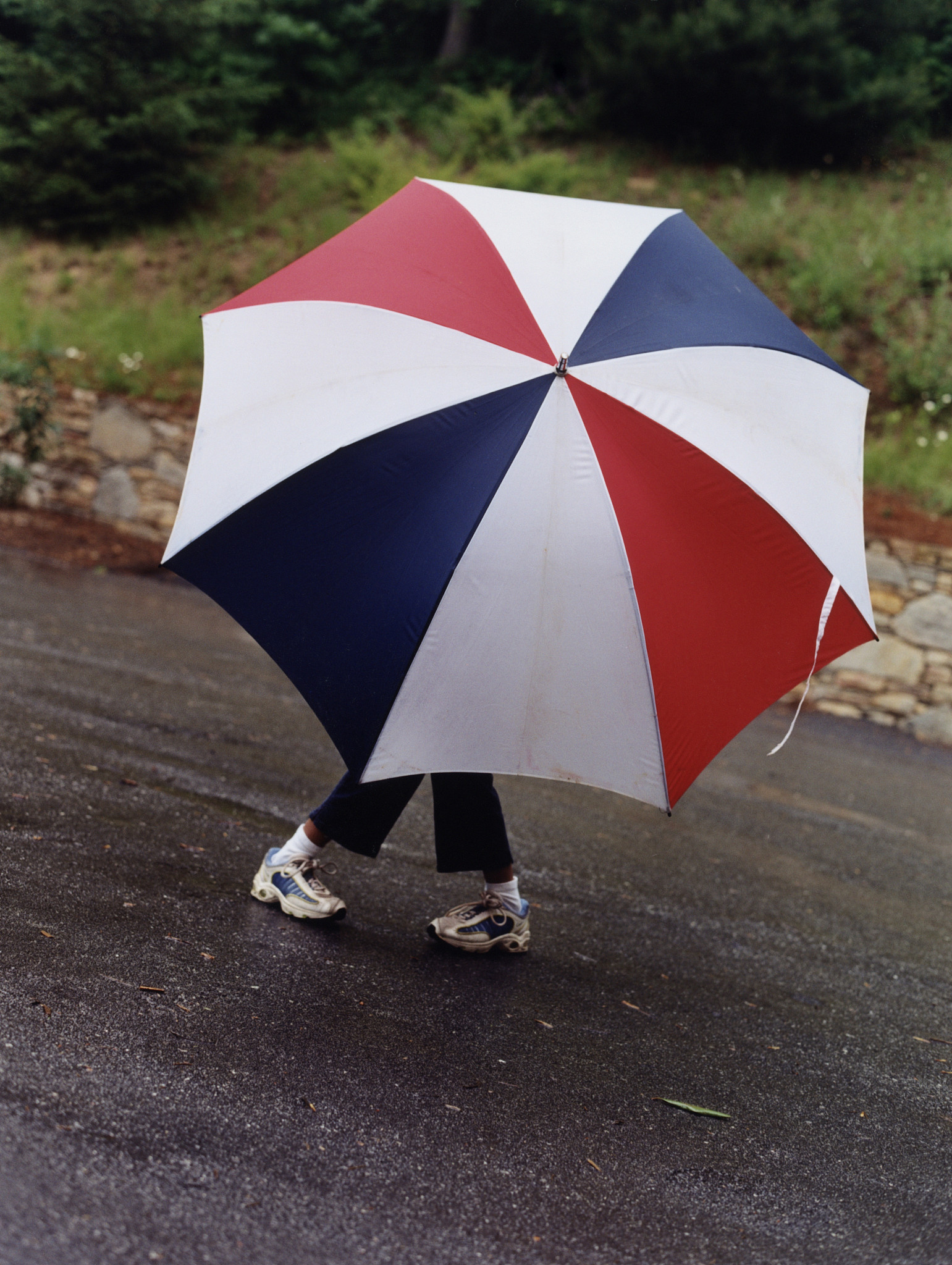 girl holding large umbrella