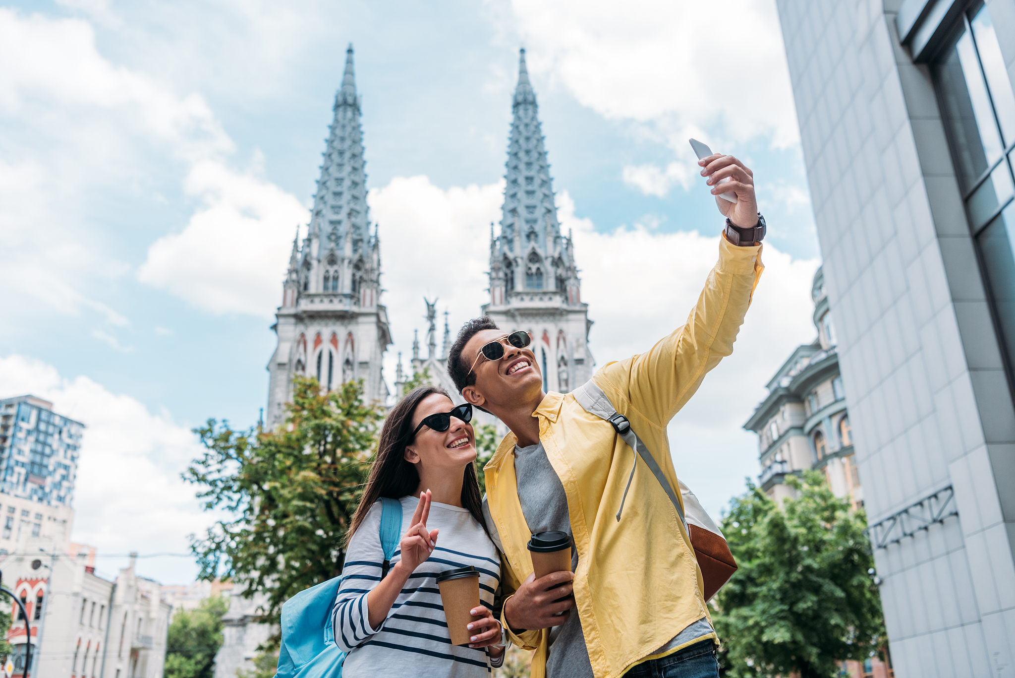 kyiv, ukraine - july 8, 2019: woman near bi-racial man in sungla