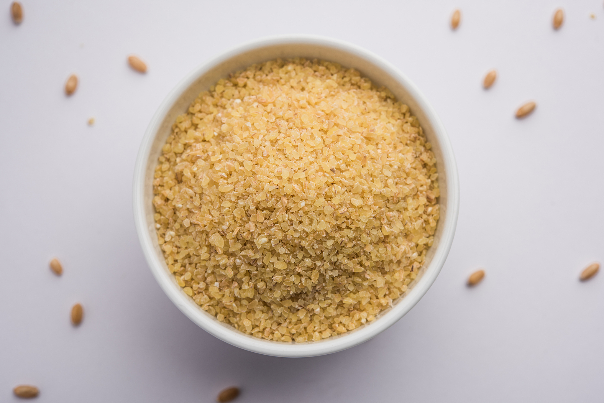 raw broken wheat or daliya or dalia, selective focus