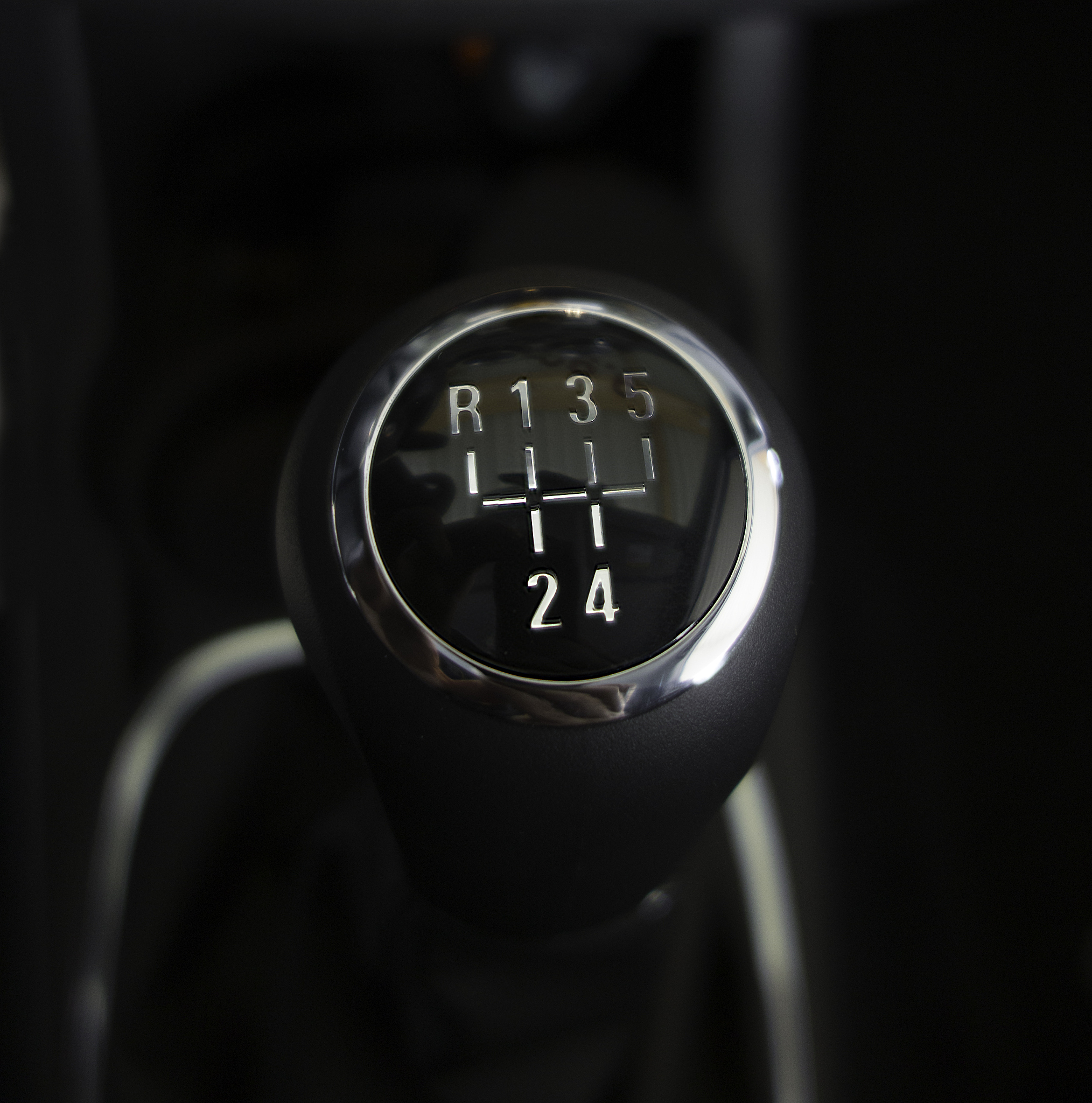 modern gearstick close up on black