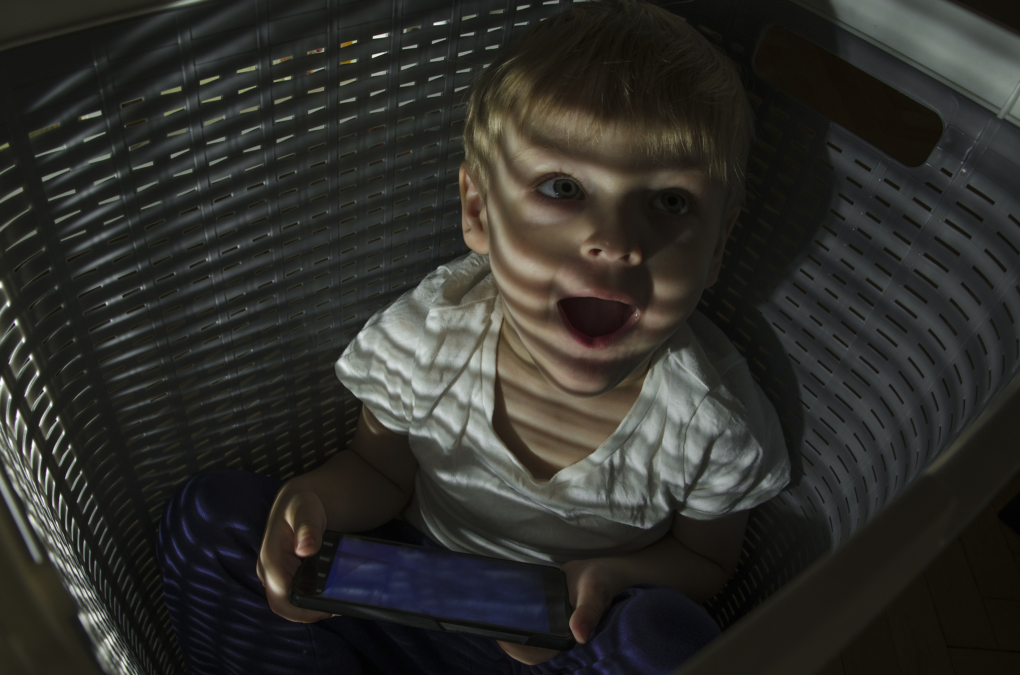 boy hides. watching cartoons. hiding from everyone. shelter for 