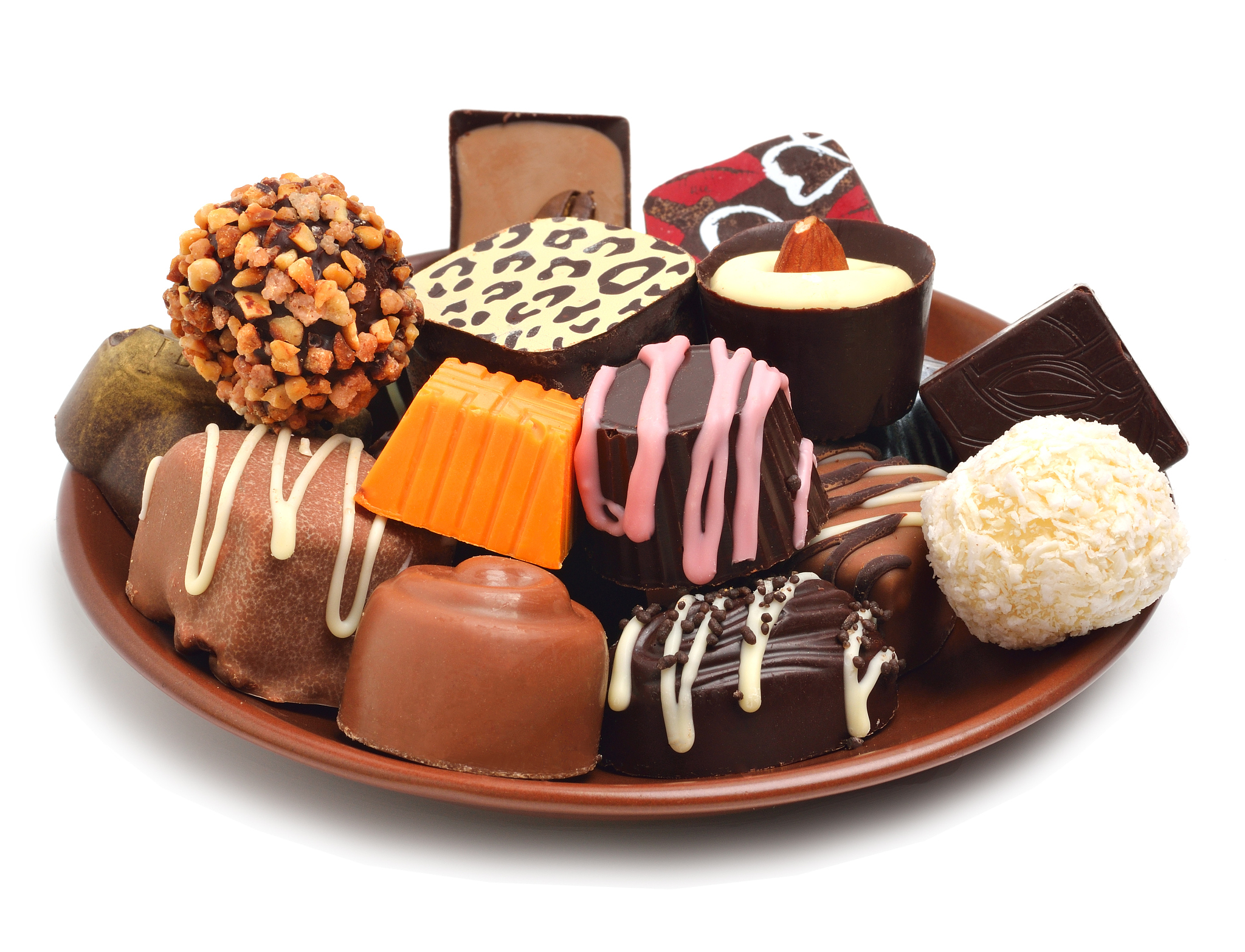 chocolate sweets on plate isolated on white