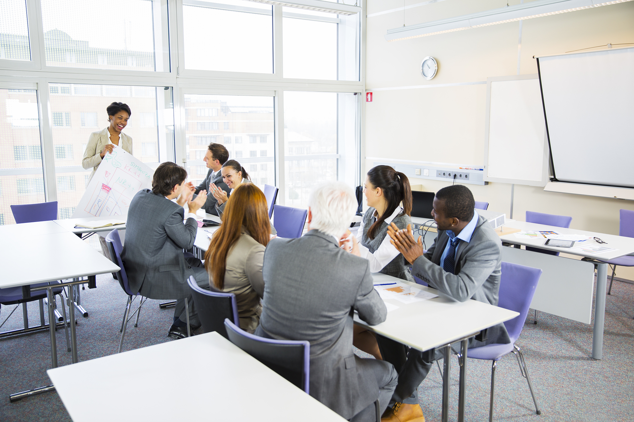 business people listening lecture of a black teacher