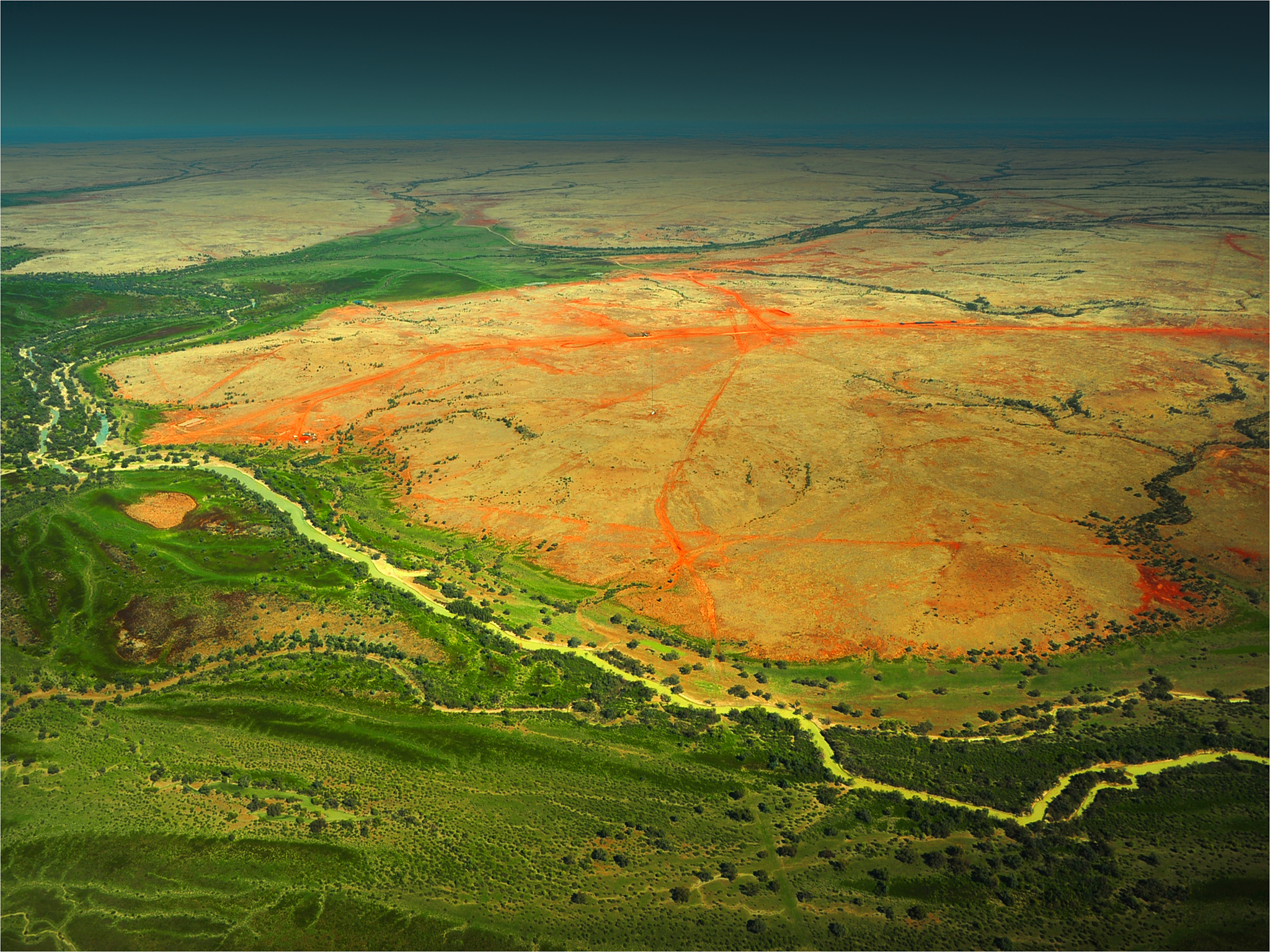 an aerial viewpoint of the vast and almost empty channel country