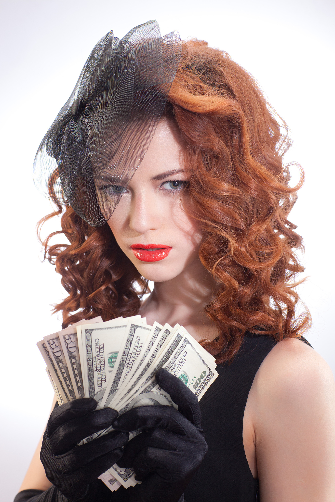 young woman holding dollars money