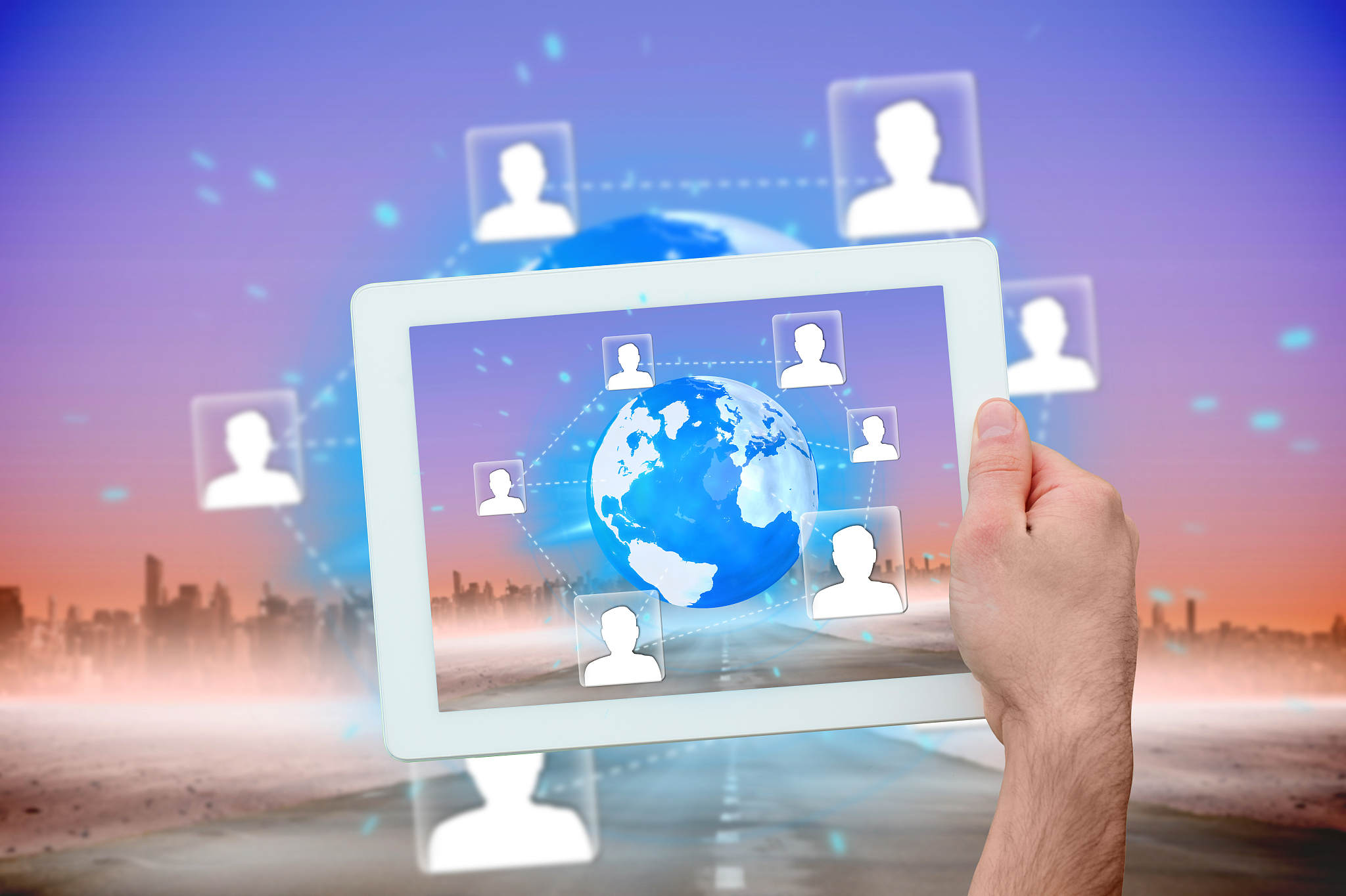 hand holding tablet pc showing global community