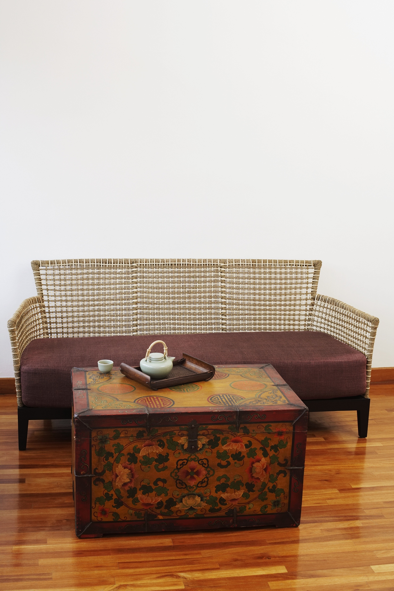teapot and a tea cup with a tray on a trunk