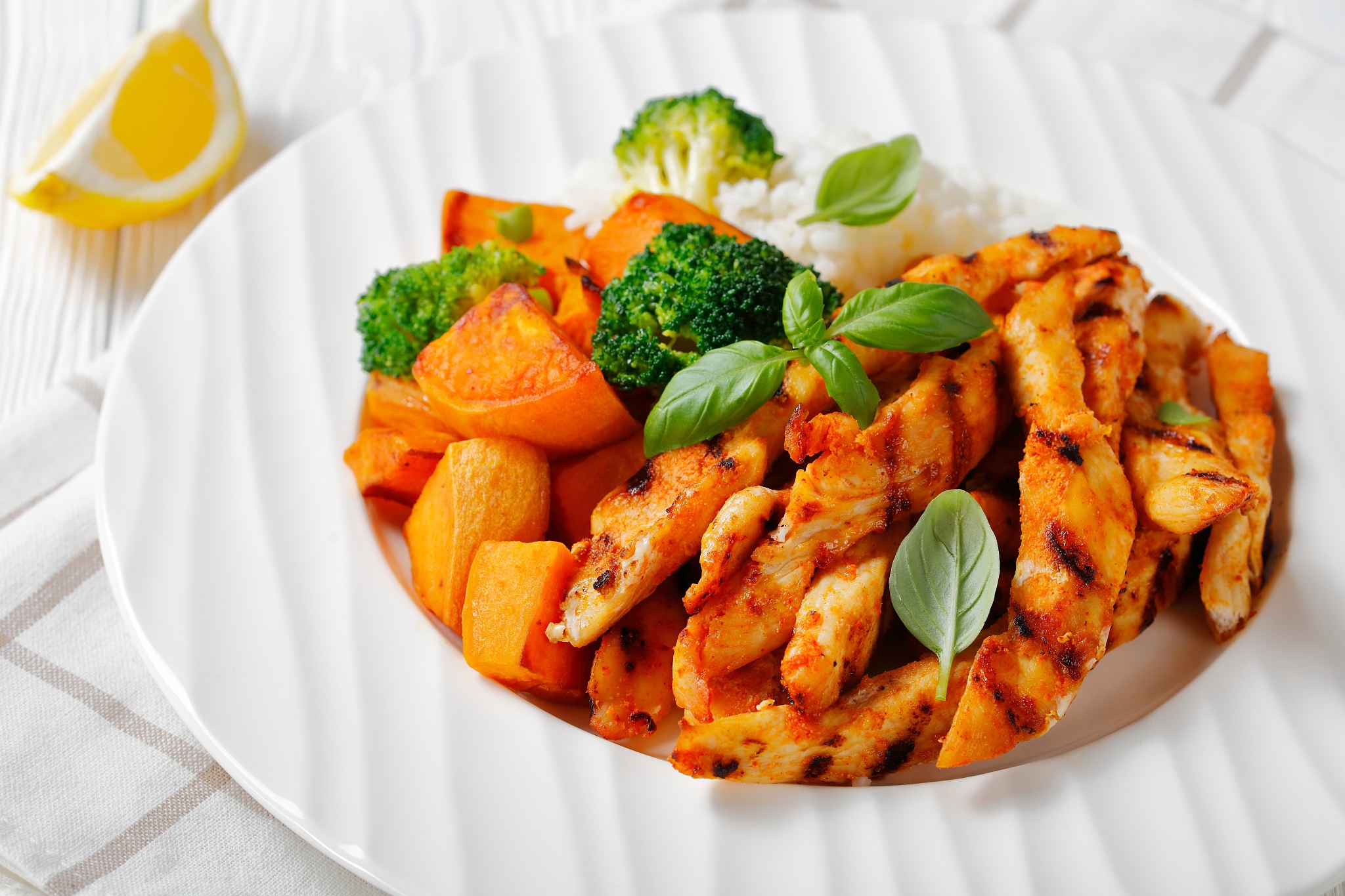 grilled paprika chicken strips served with roasted sweet potatoe