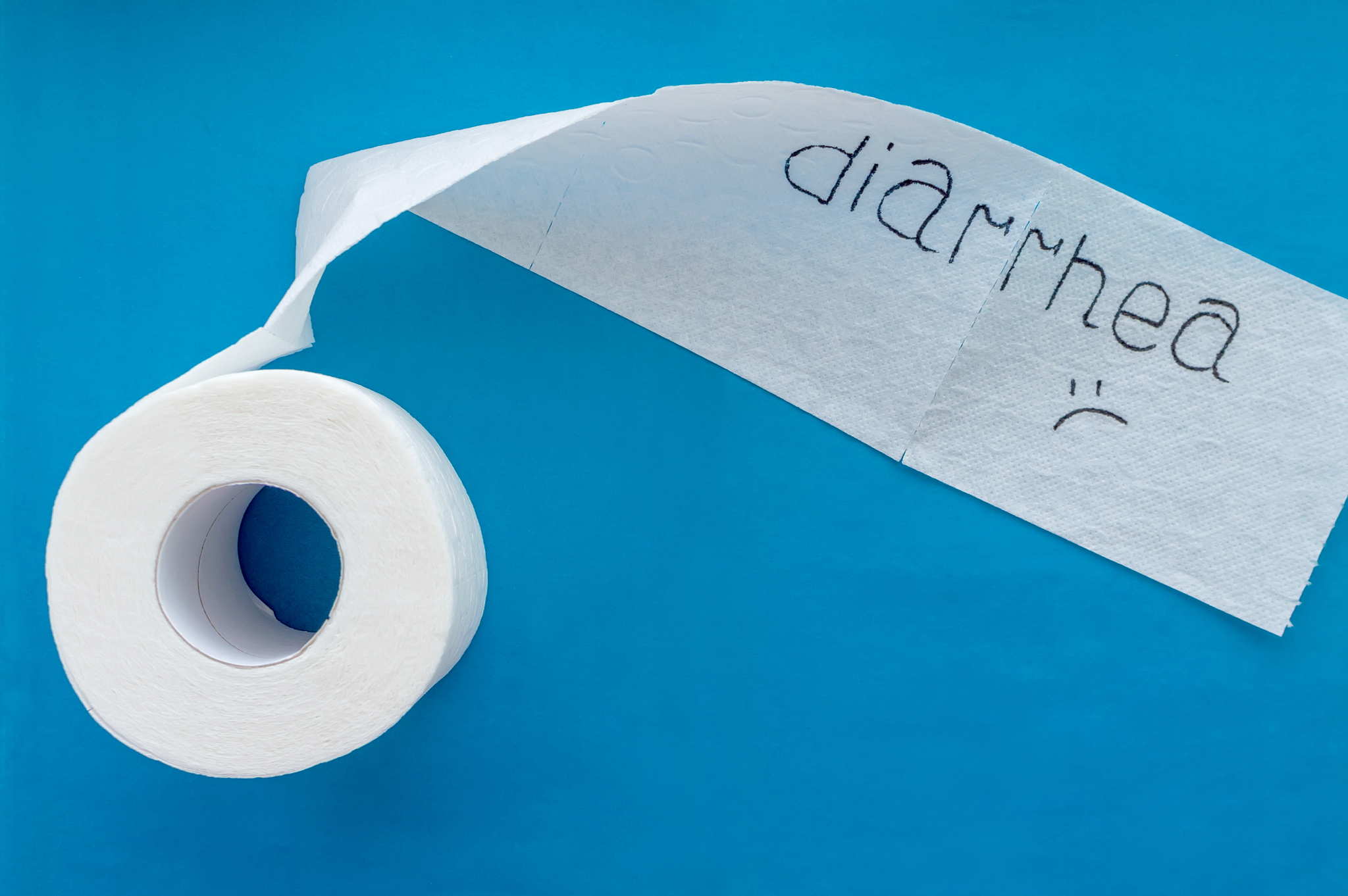 a roll of white toilet paper labeled "diarrhea" on a blue backgr