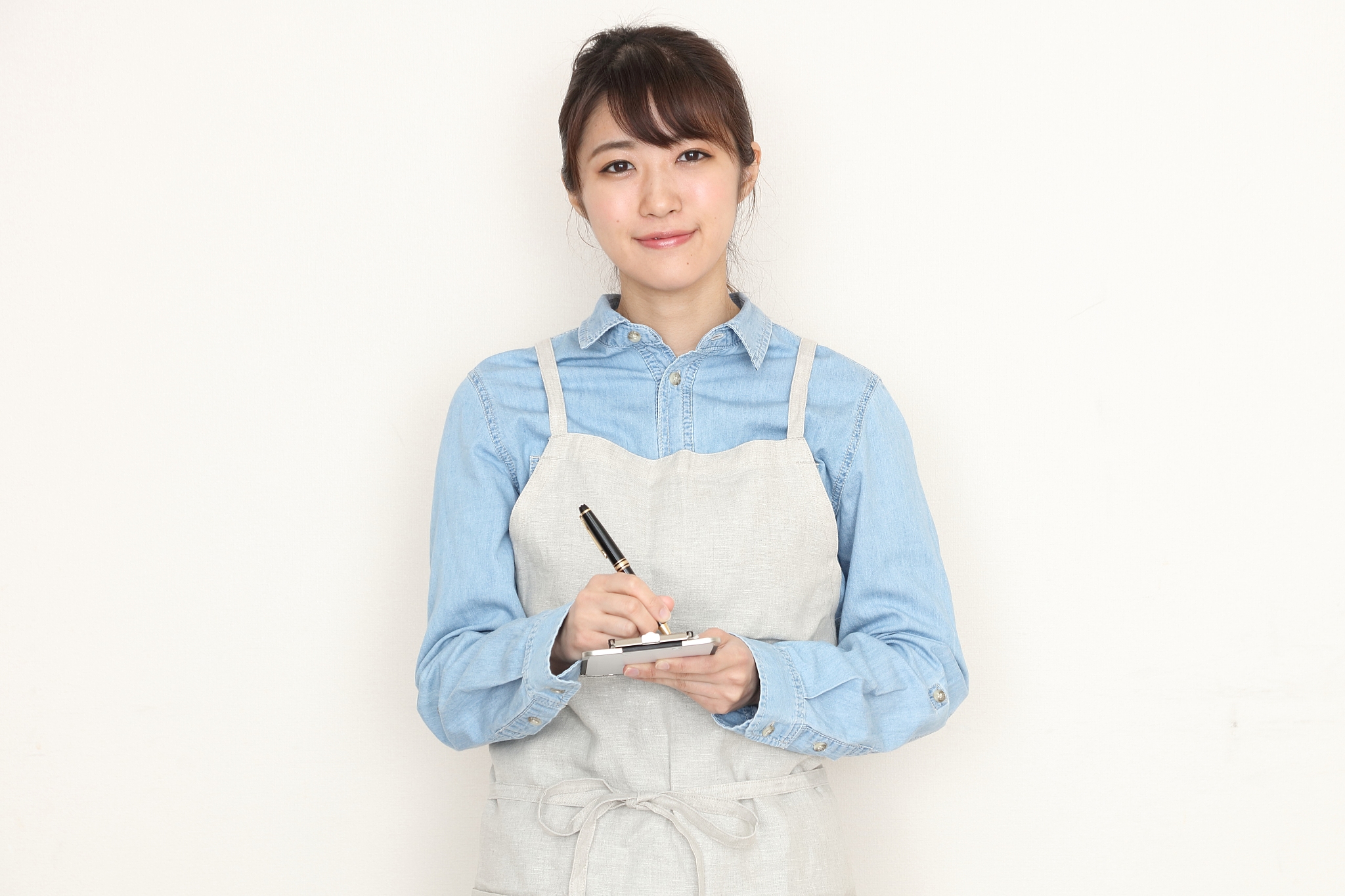 a portrait of asian waitress isolated on white background