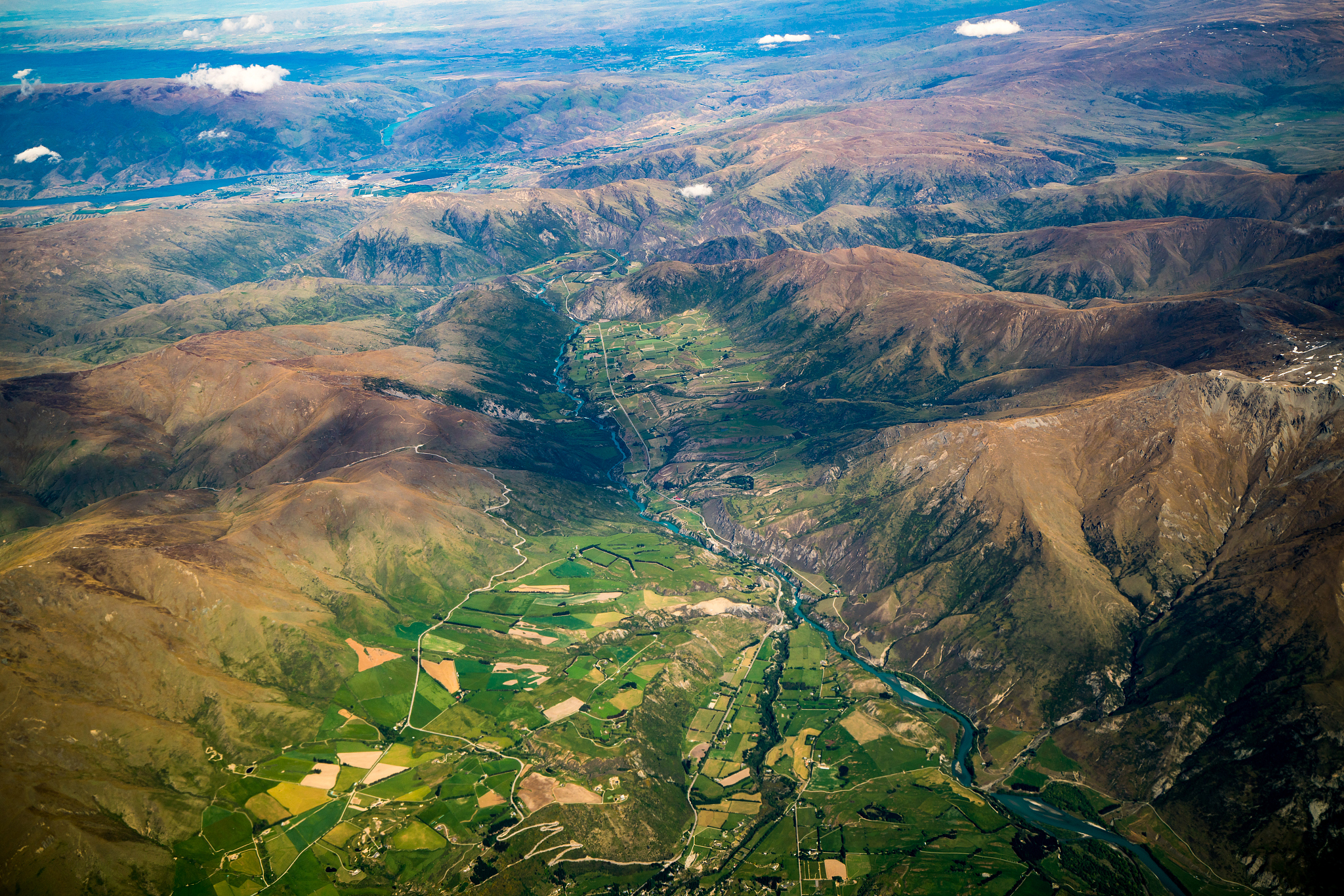 aerial view of mountain ranges and lake landscape
