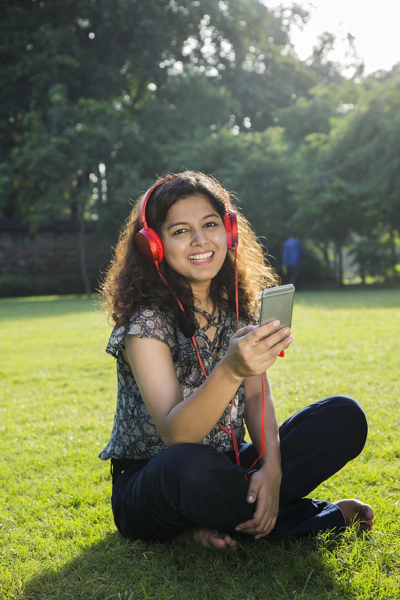 young girl listening to music - stock image