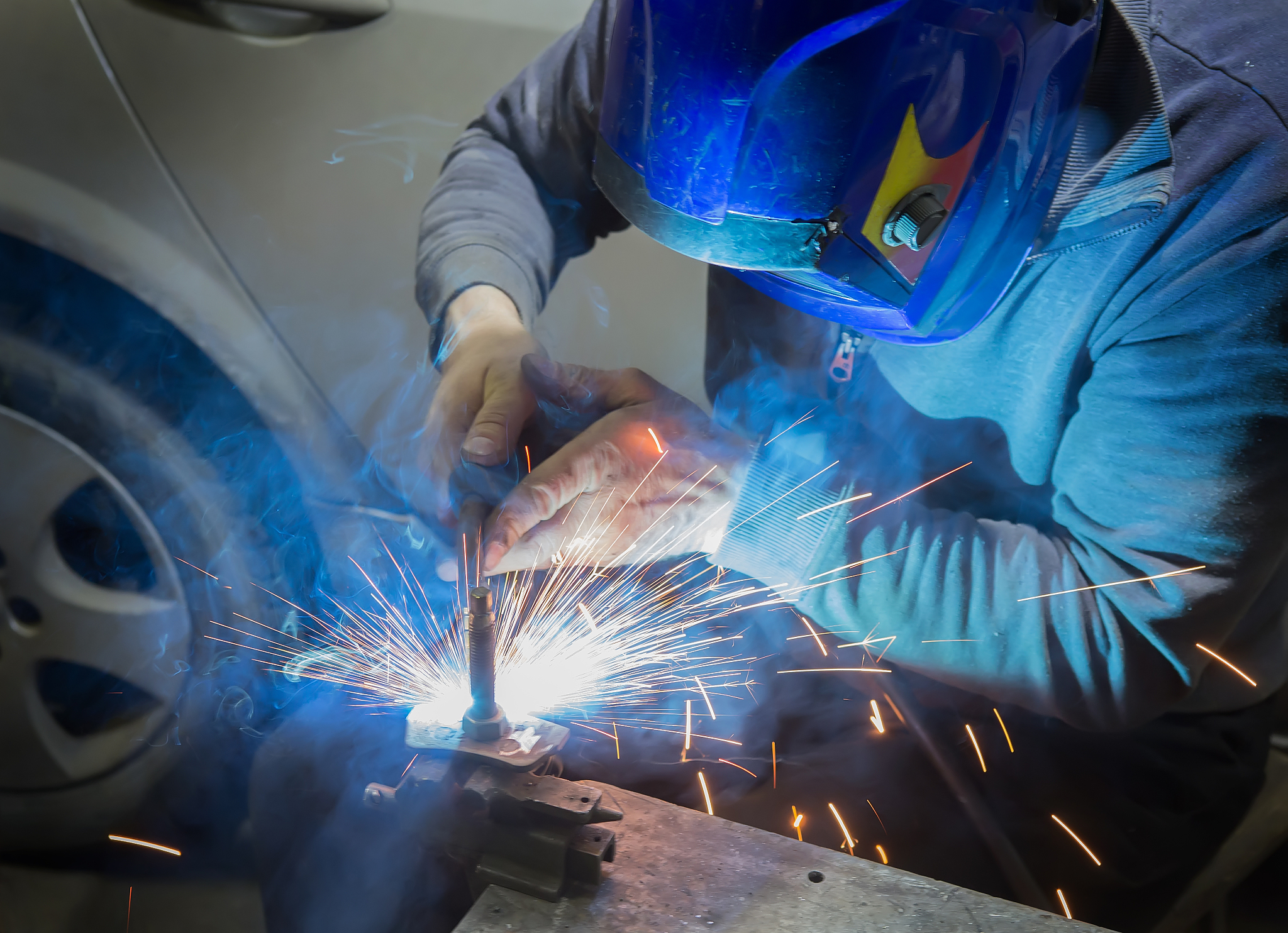 welder welds metal details