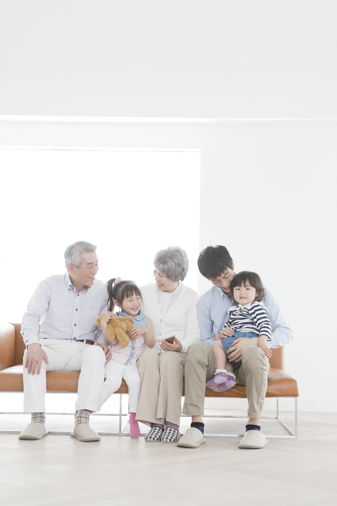 a family sitting on a sofa