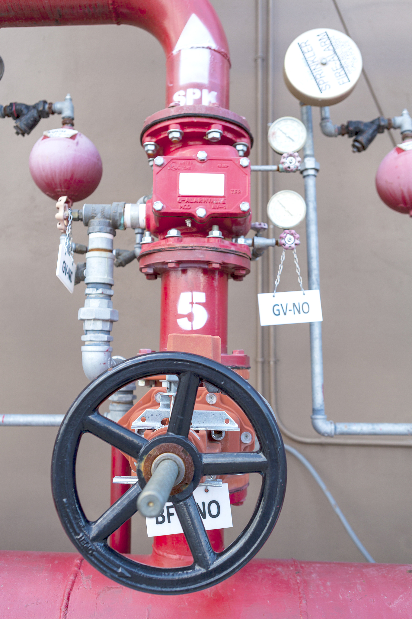 Please rephrase the following sentence for clarity according to the style of SCI journalsUnder the high temperature of fire the moisture in the concrete will be heated into water vapor which will caus