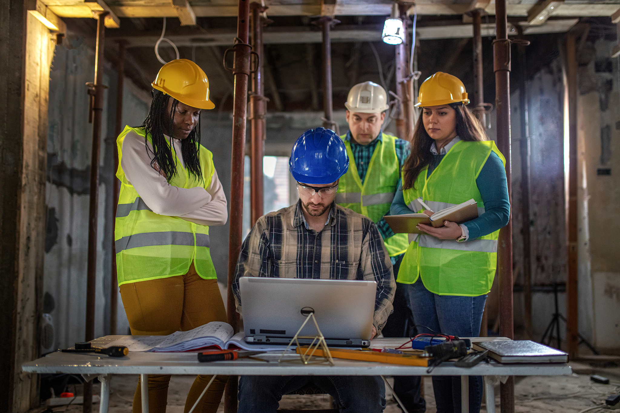 workers at construction job site inside building