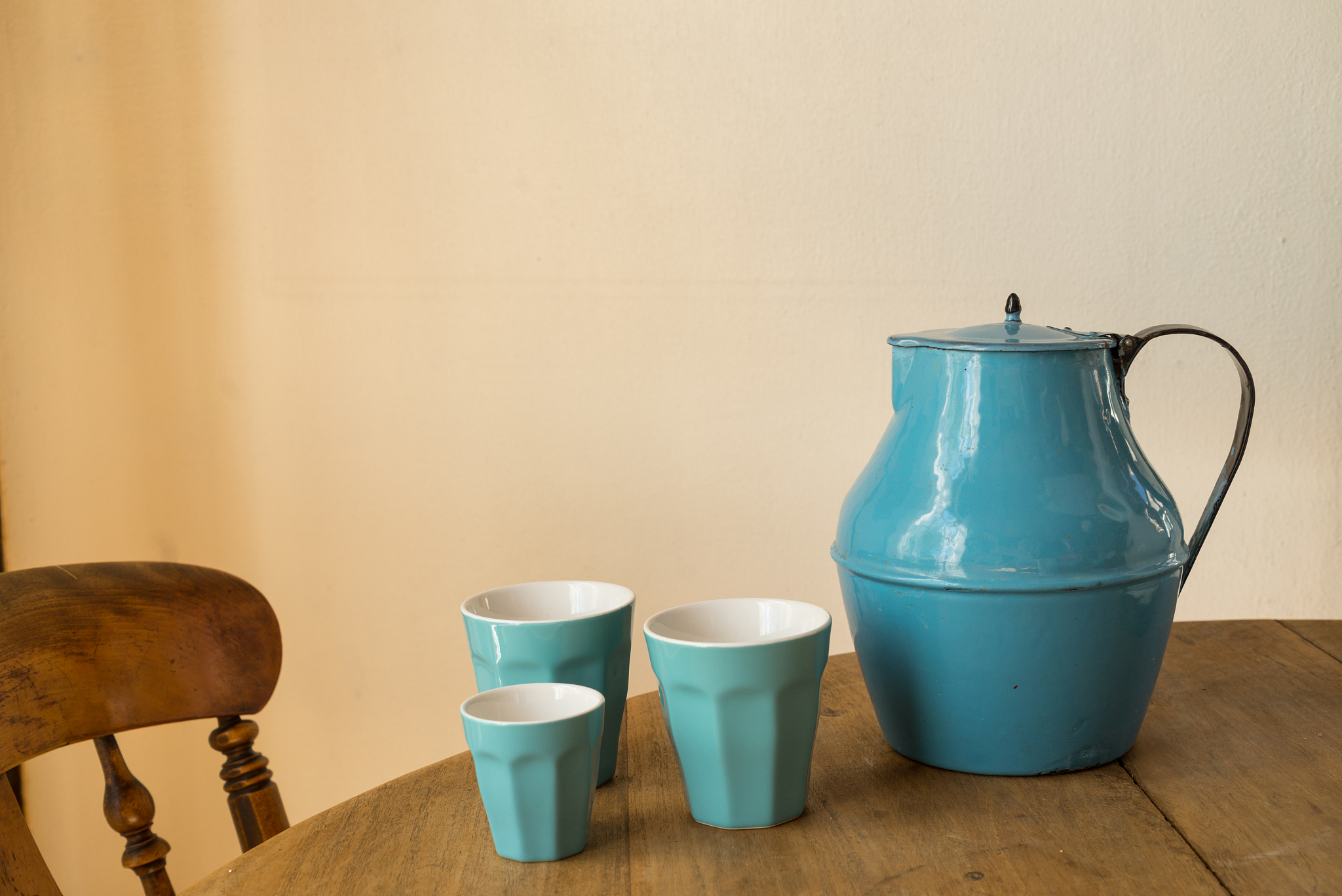 ceramic jug and drinking glasses on table