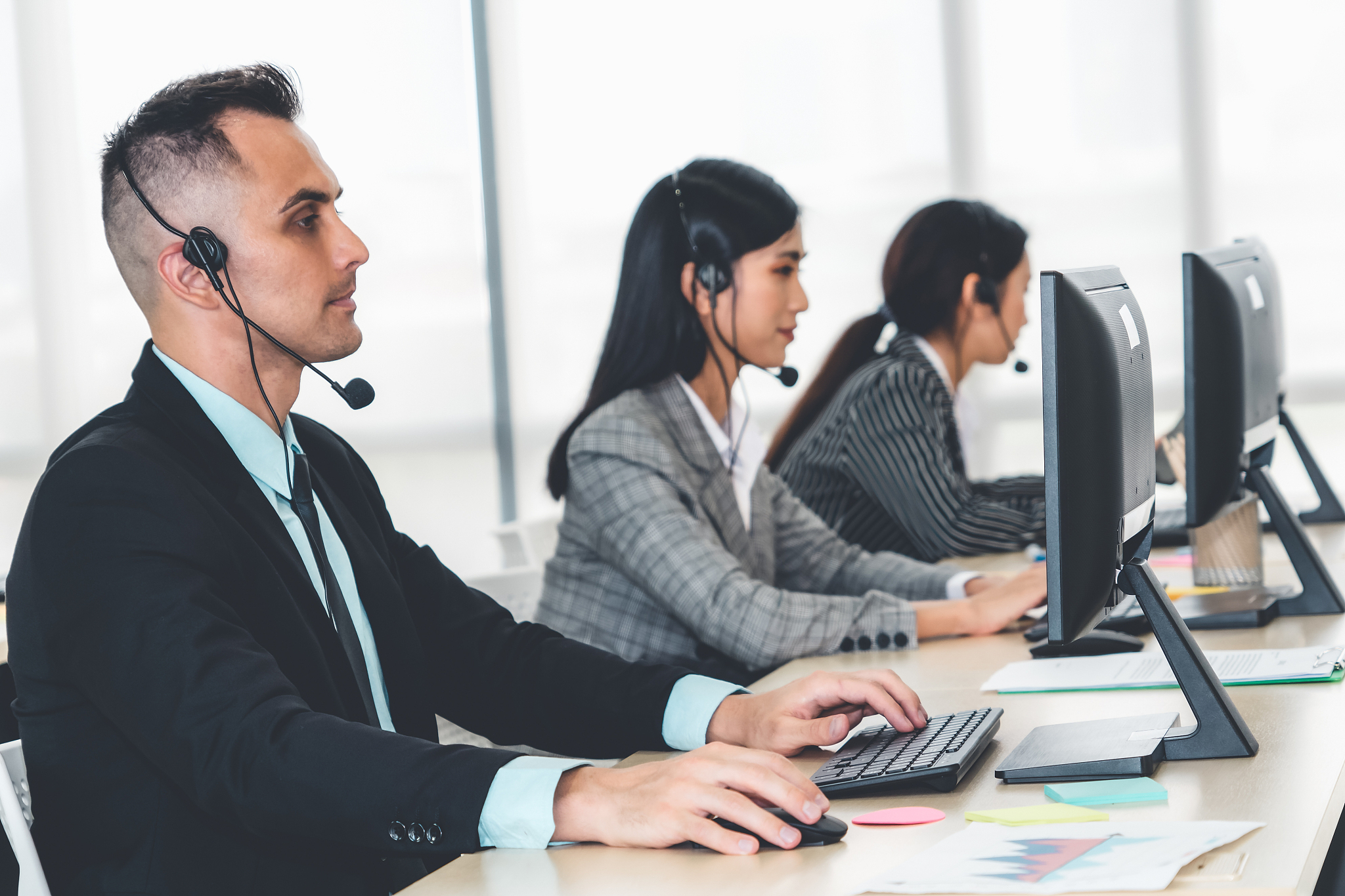 business people wearing headset working in office