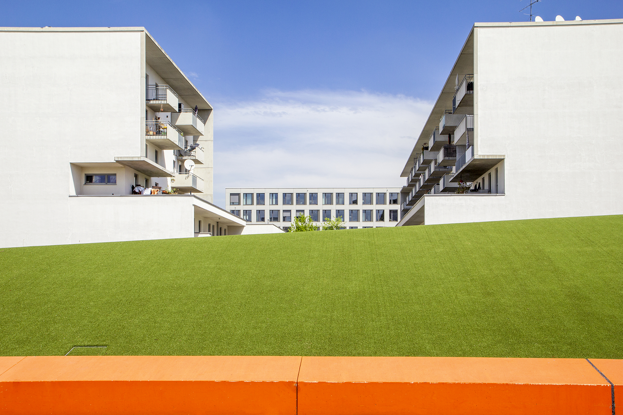 germany, bavaria, munich, green lawn in front of residential bui