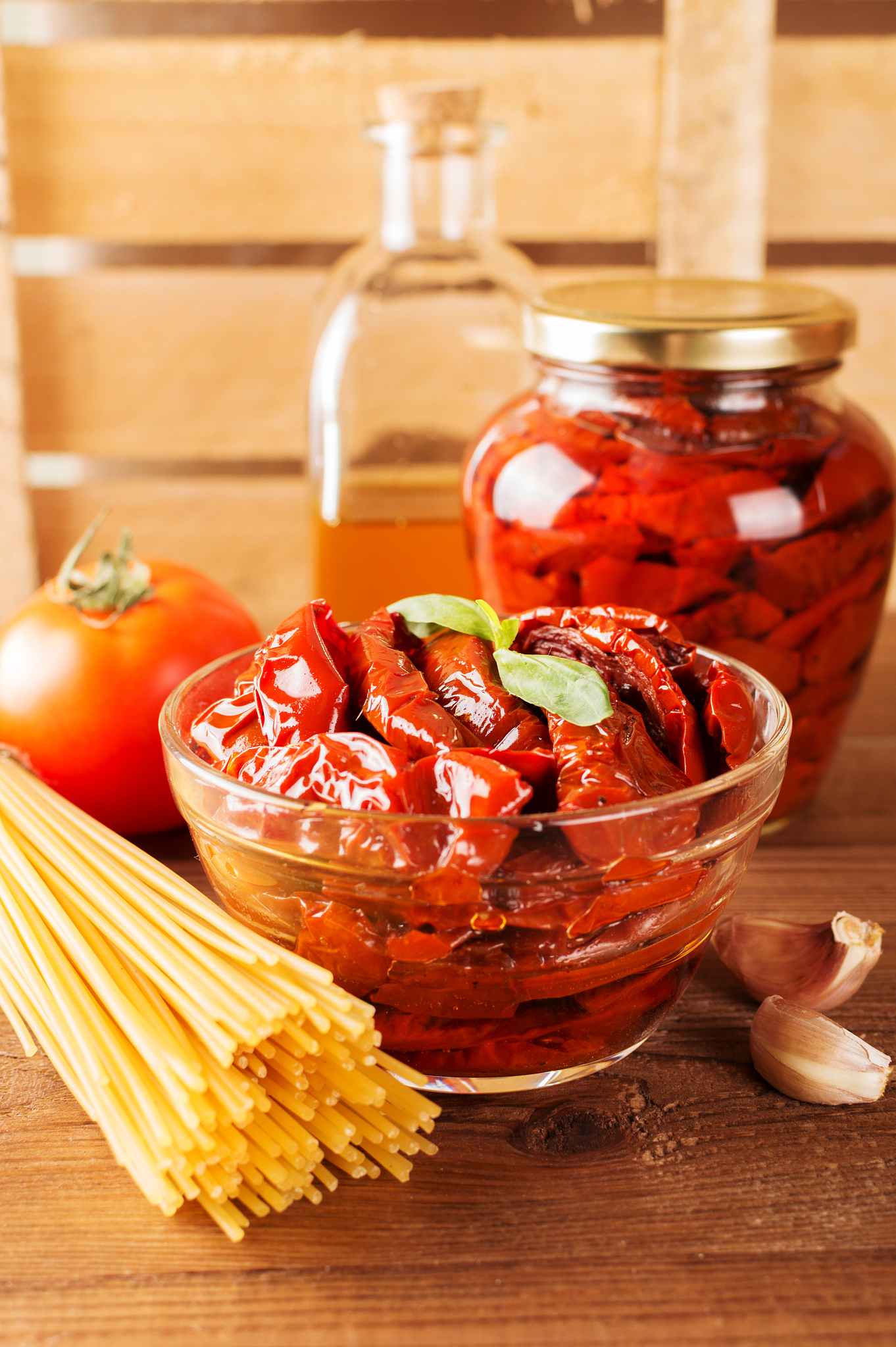 italian spaghetti with ingredients for cooking pasta on a wooden