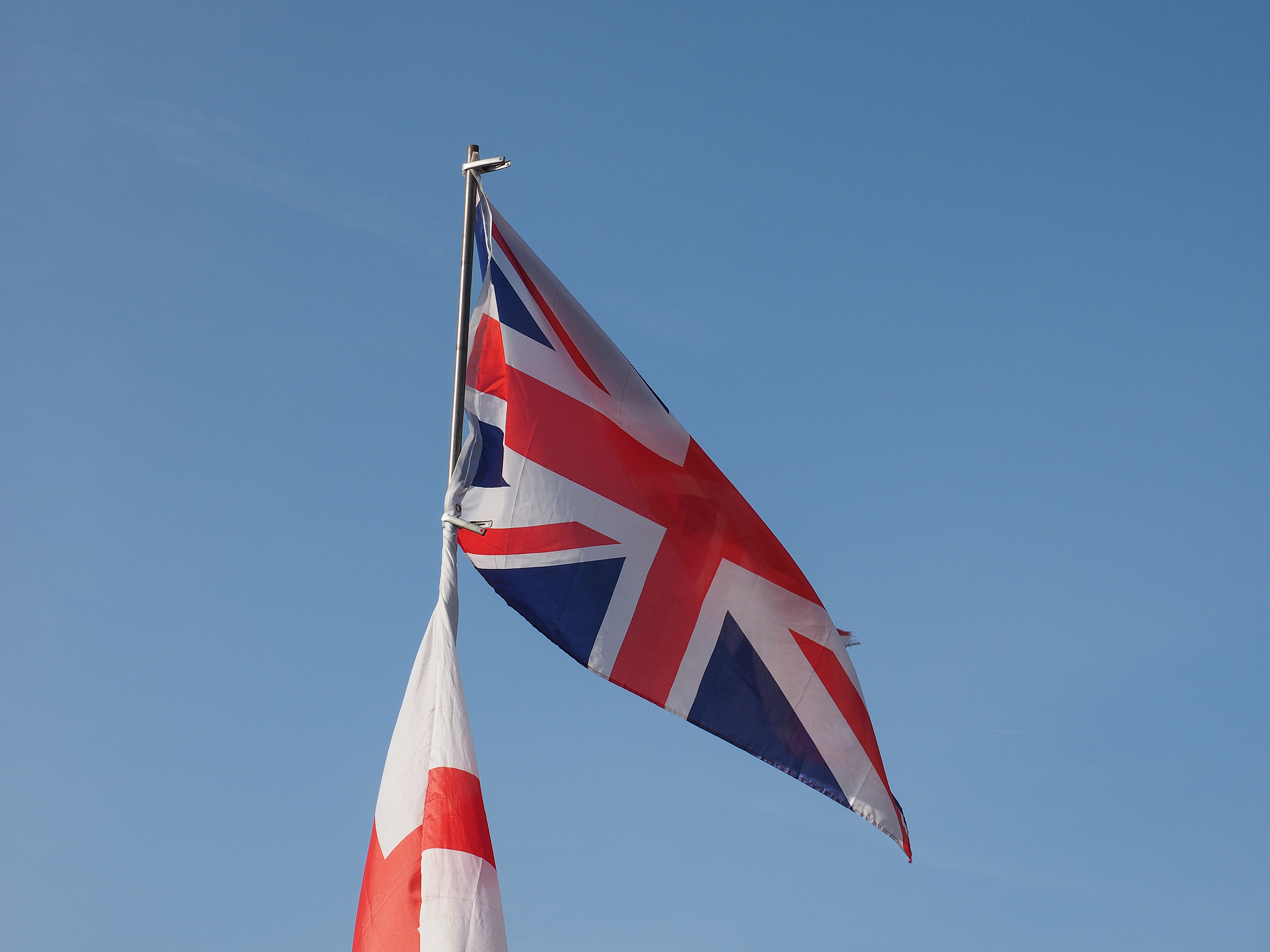 flag of uk over blue sky