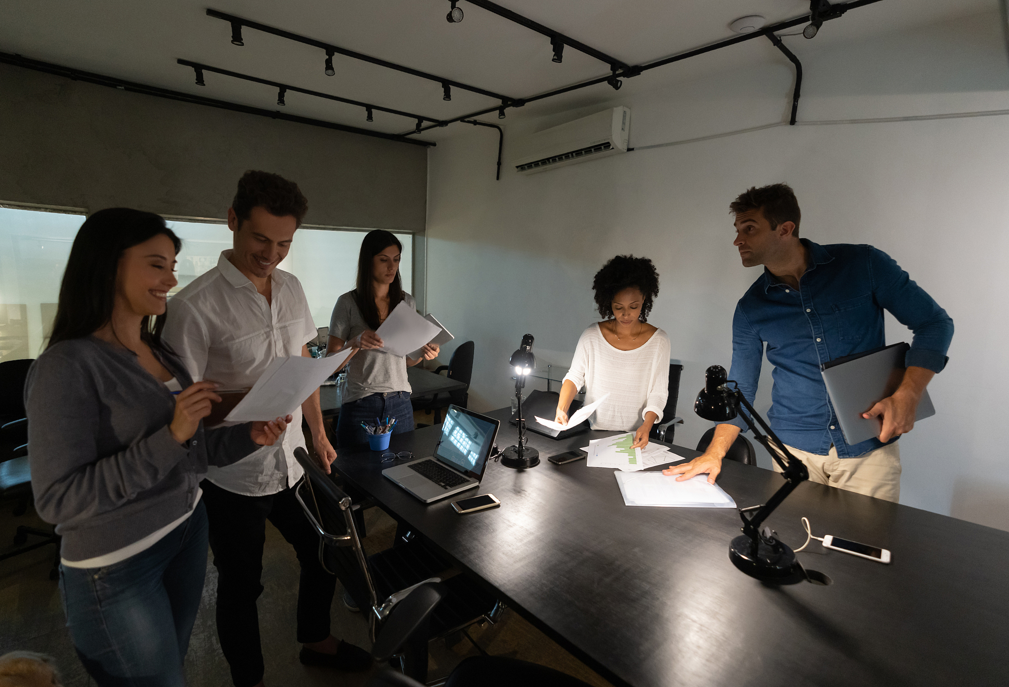 group of business people working late in a meeting at the office