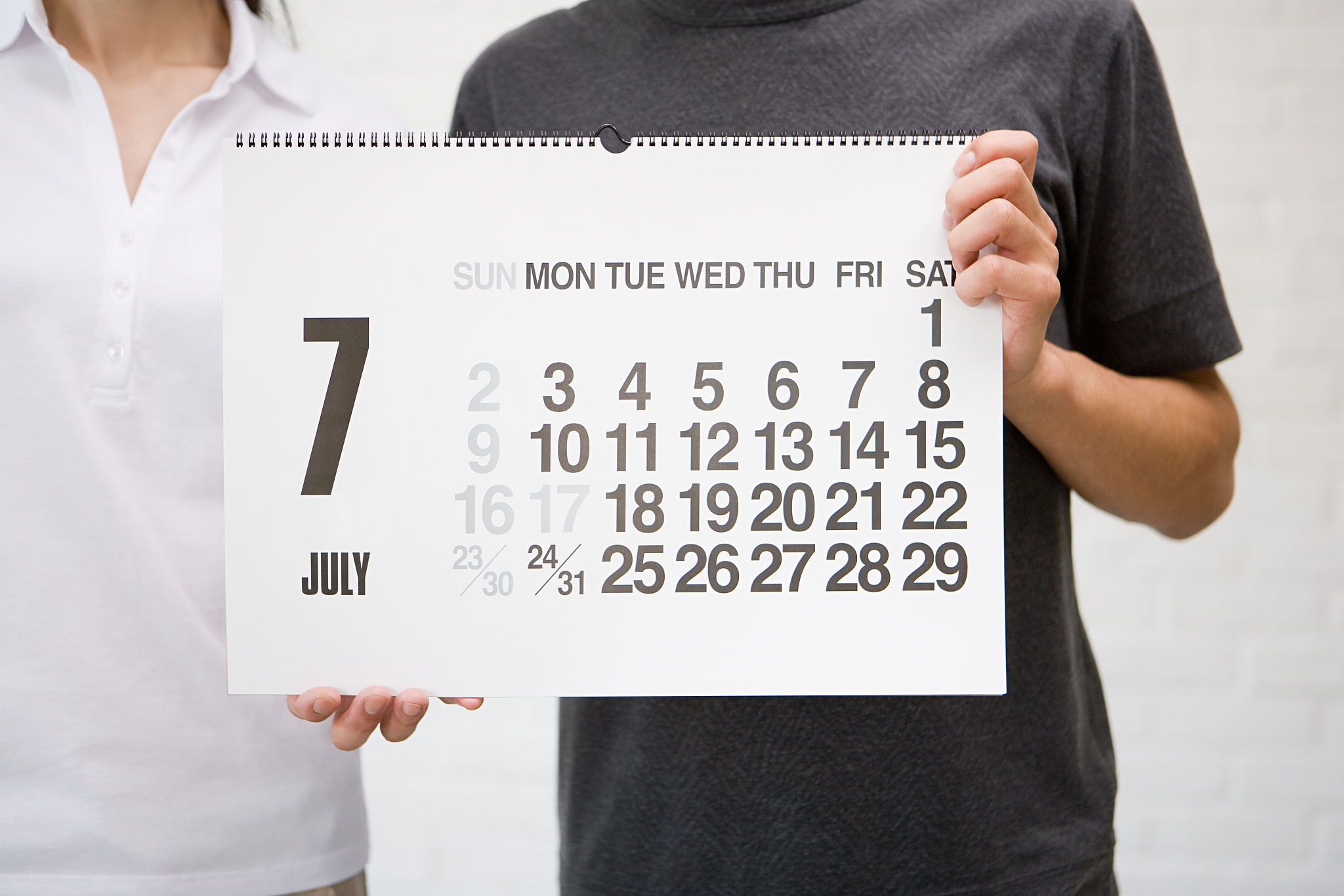 two people with a calendar