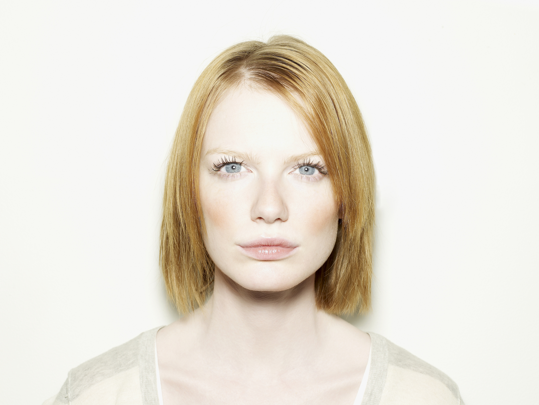 Beautiful Woman Admiring Her Reflection in a Mirror