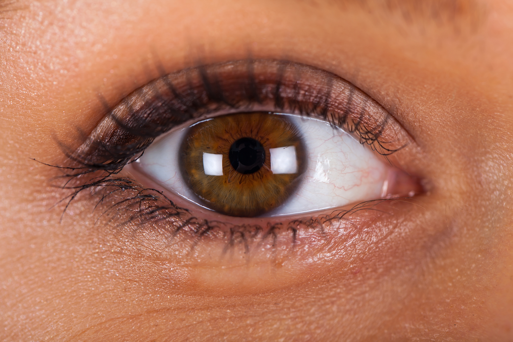 close up female hazel eye
