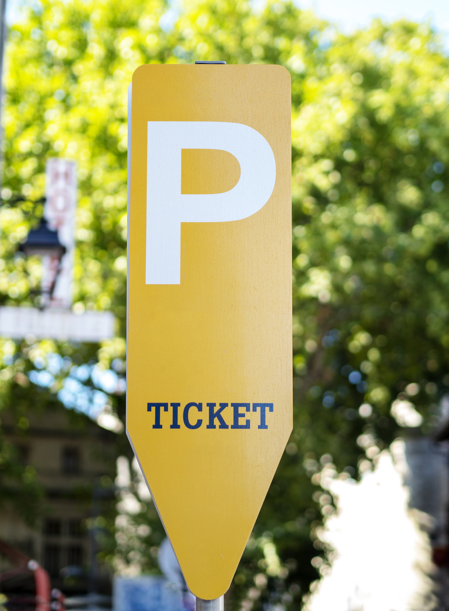 yellow parking ticket machine