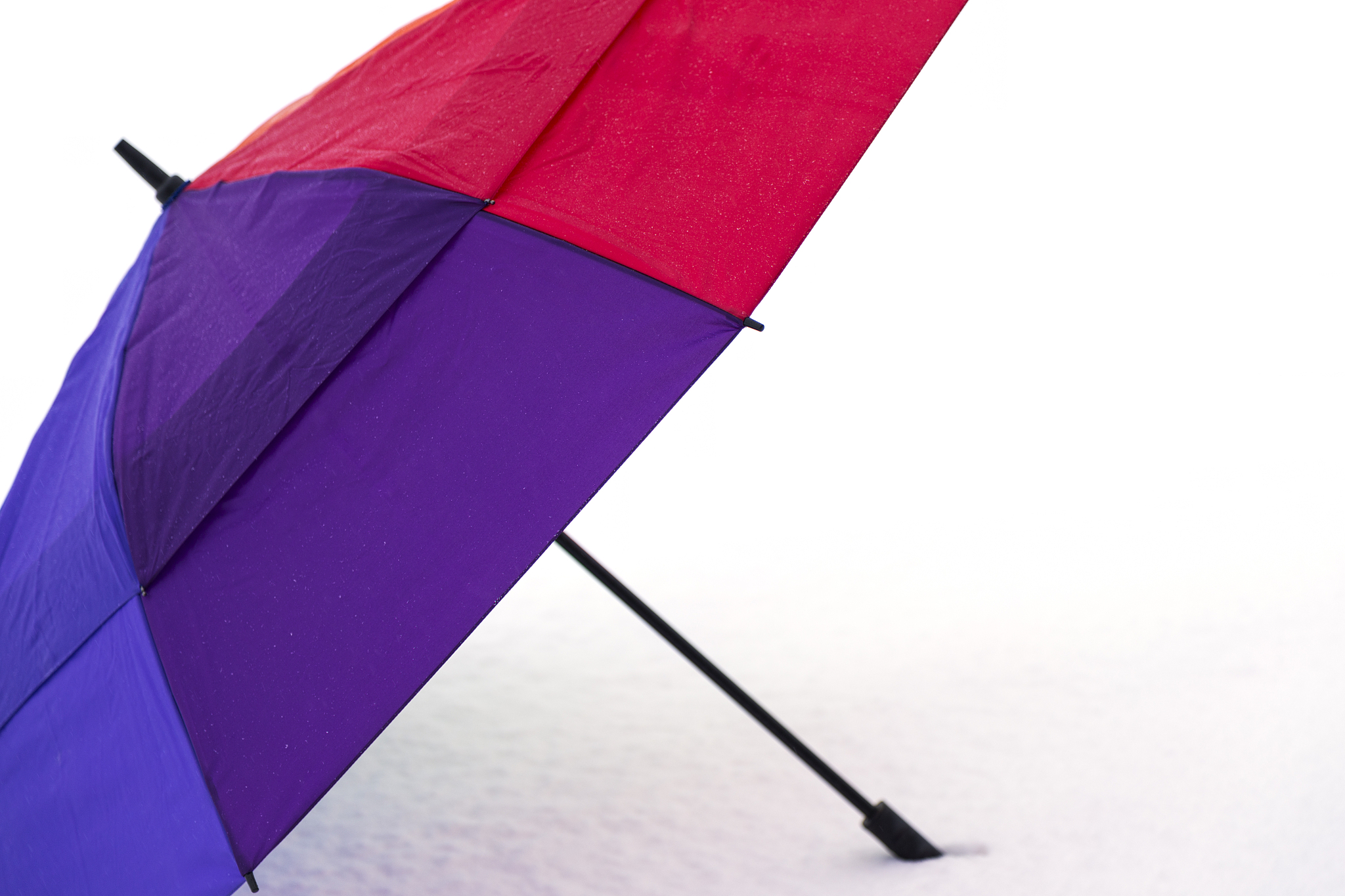 multi-color umbrella in snow