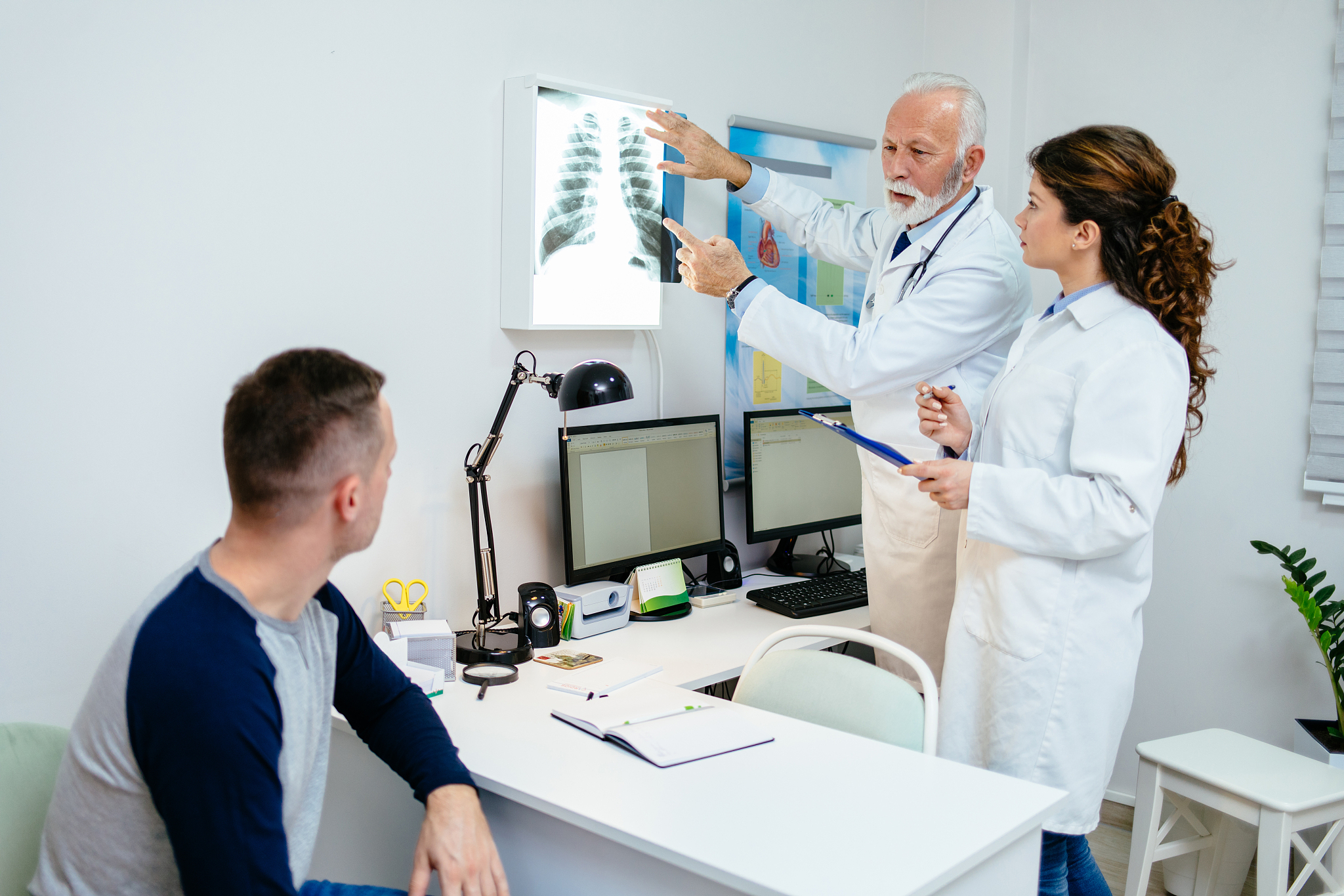 medical doctors looking at x-rays for diagnose in a hospital