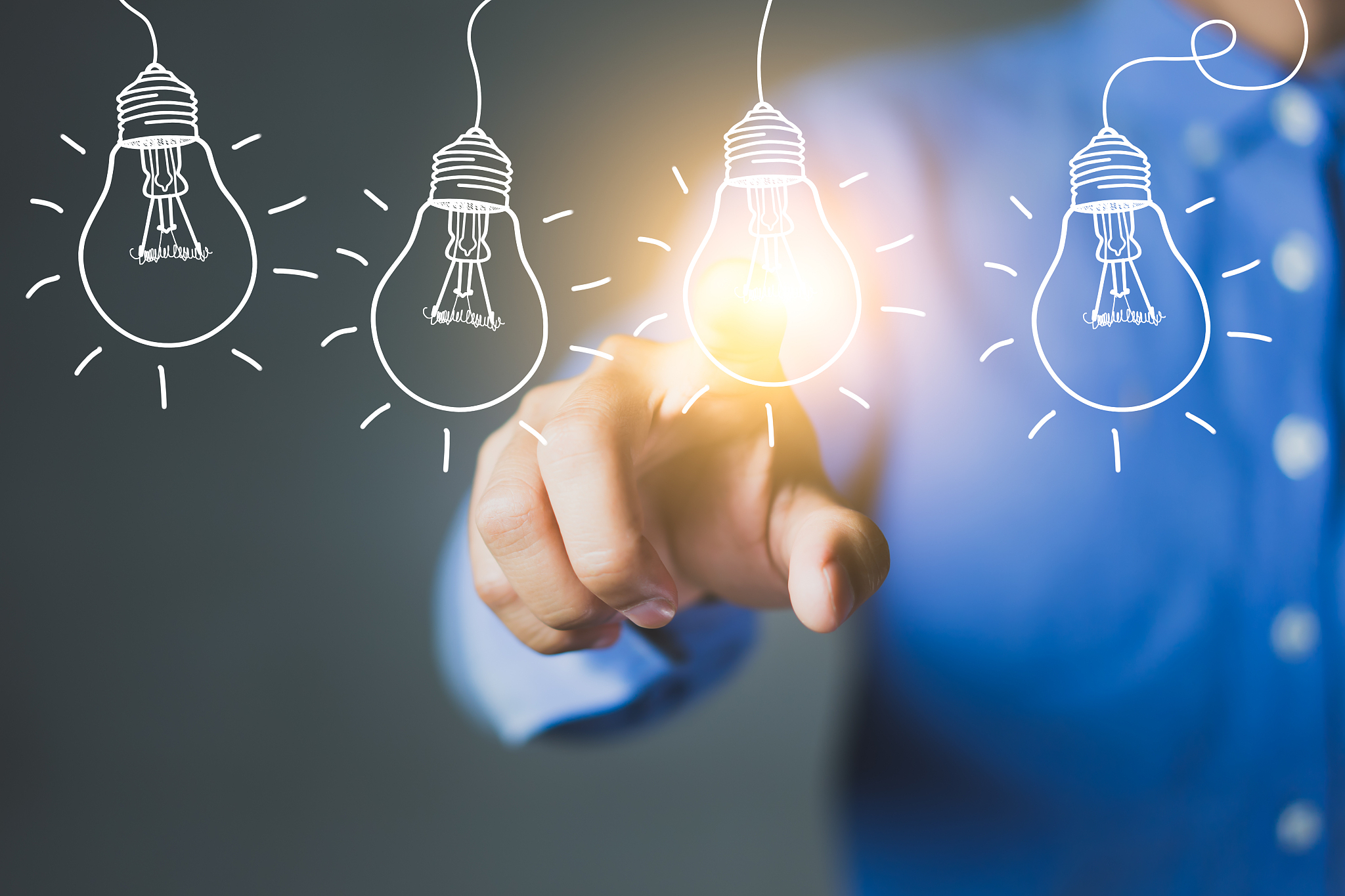 businessman hand touching light bulbs, new ideas with innovative