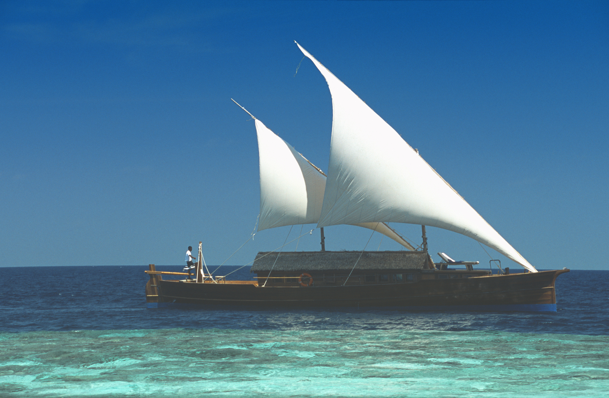 traditional dhoni sailing in the maldives, indian