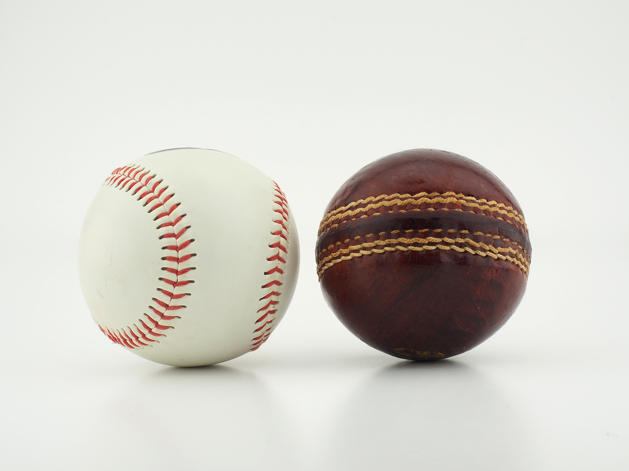 baseball and cricket ball.