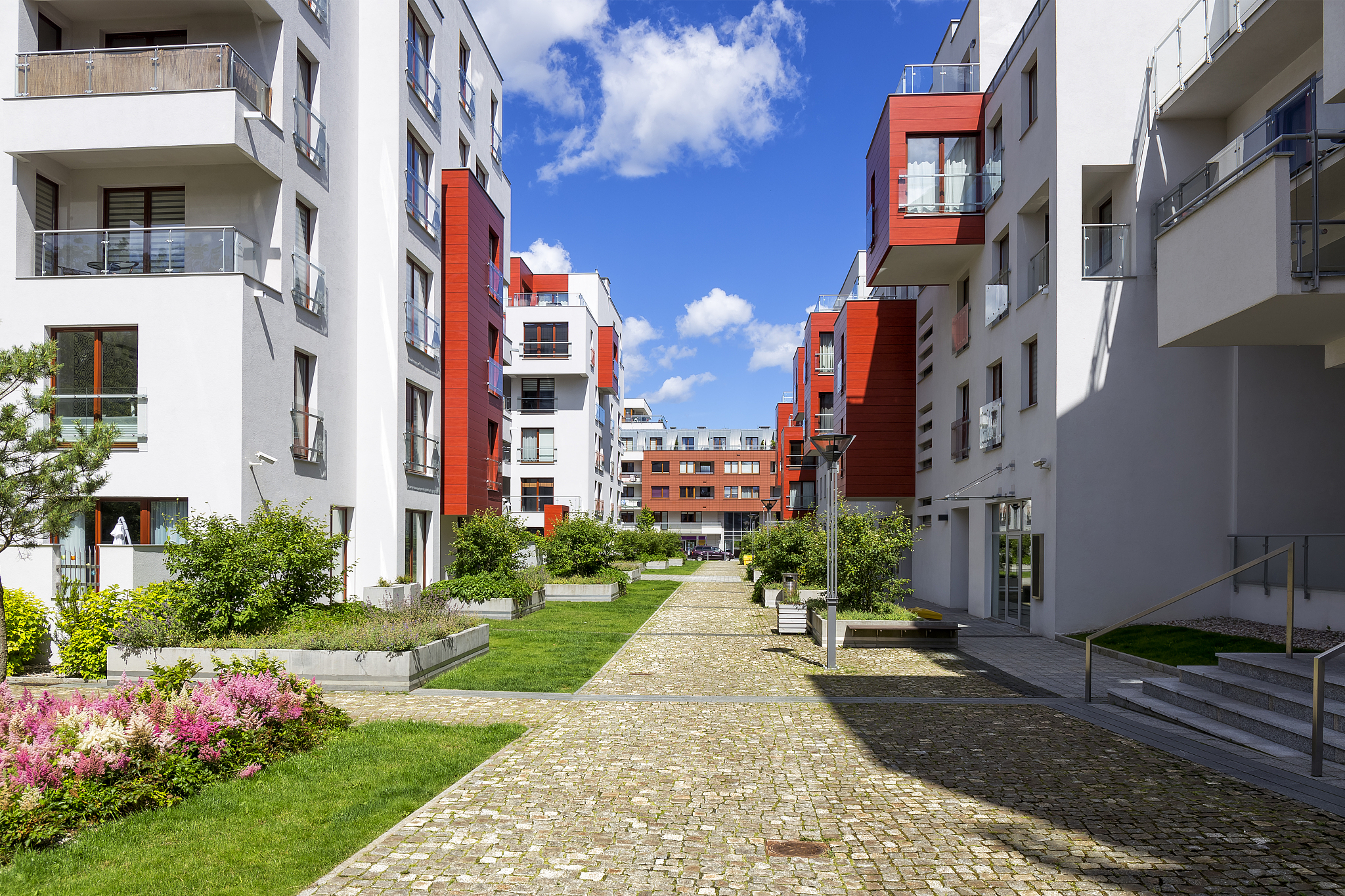 pedestrian walkway leading through a new housing estate