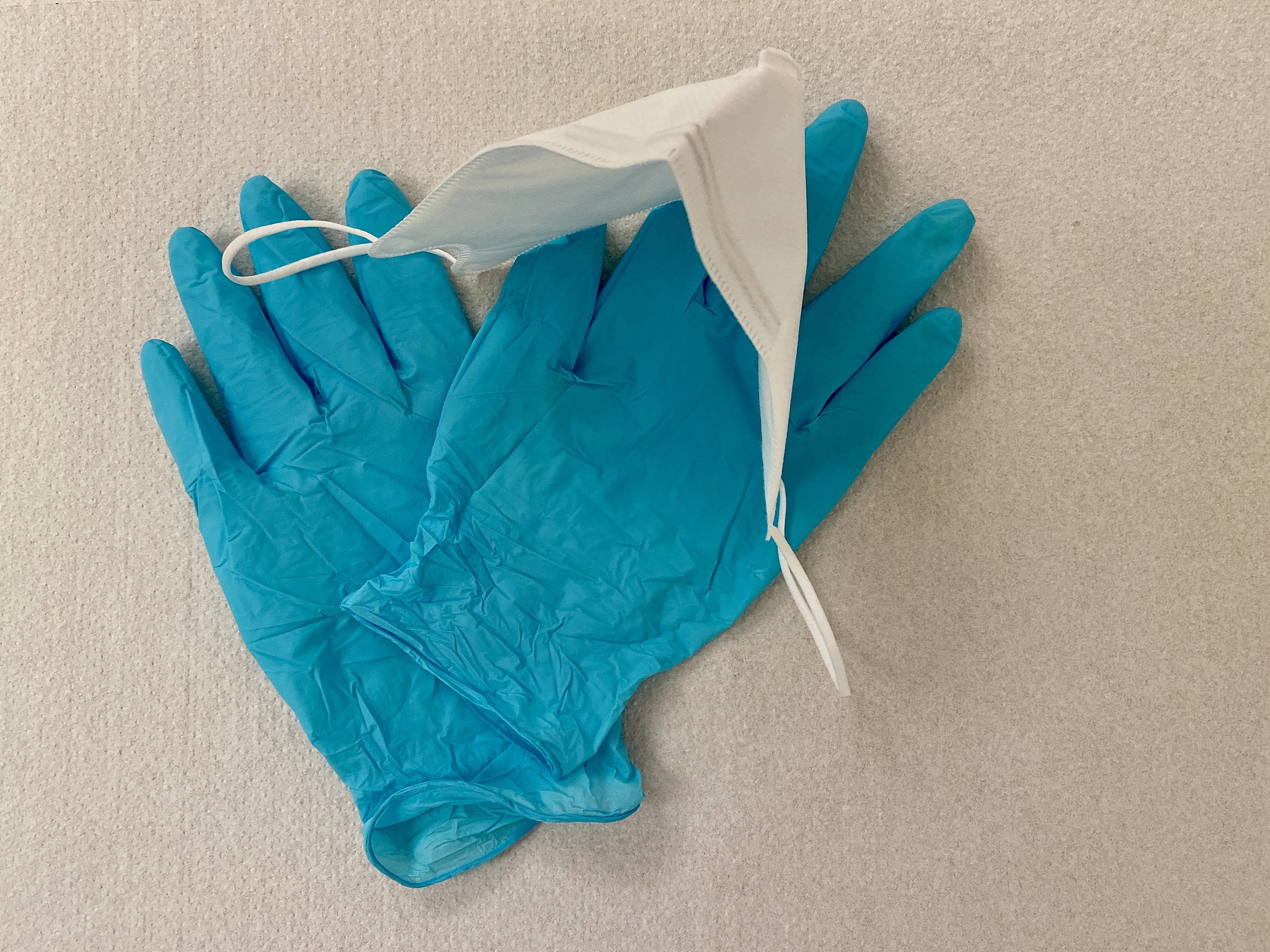 blue protective gloves and ffp2 face mask