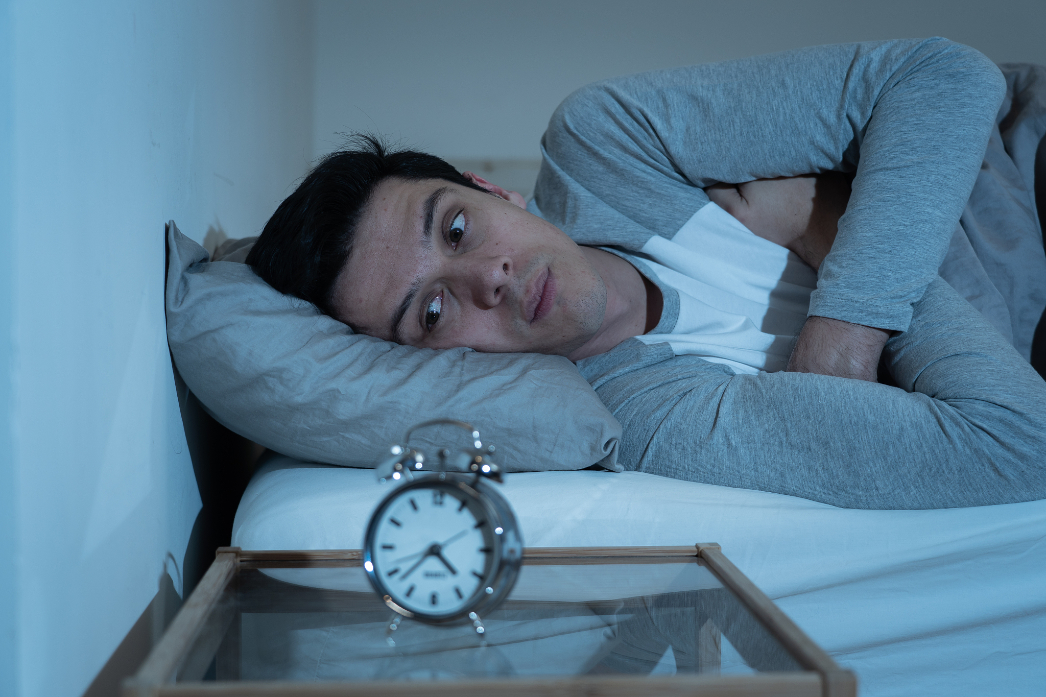 sleepless and desperate young caucasian man awake at night not a